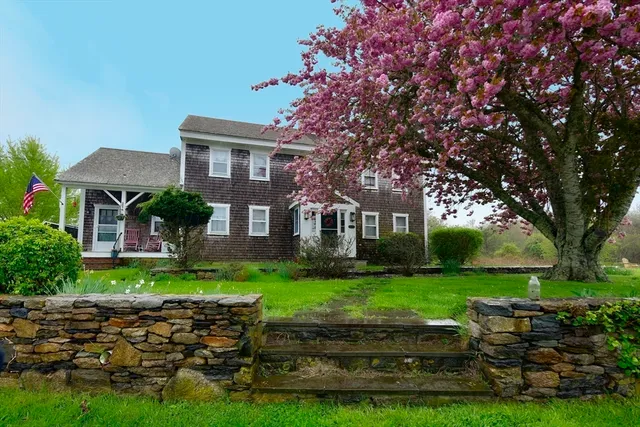a front view of a house with a yard
