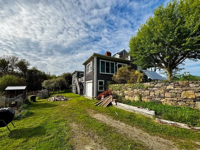 a view of backyard with sitting area