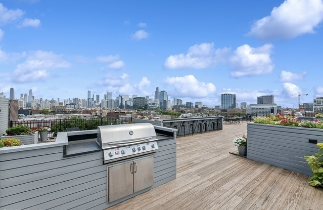 515 North Noble Street, Unit 308 Chicago, IL 60642 - Photo 13 of 13 a view of a terrace with wooden floor