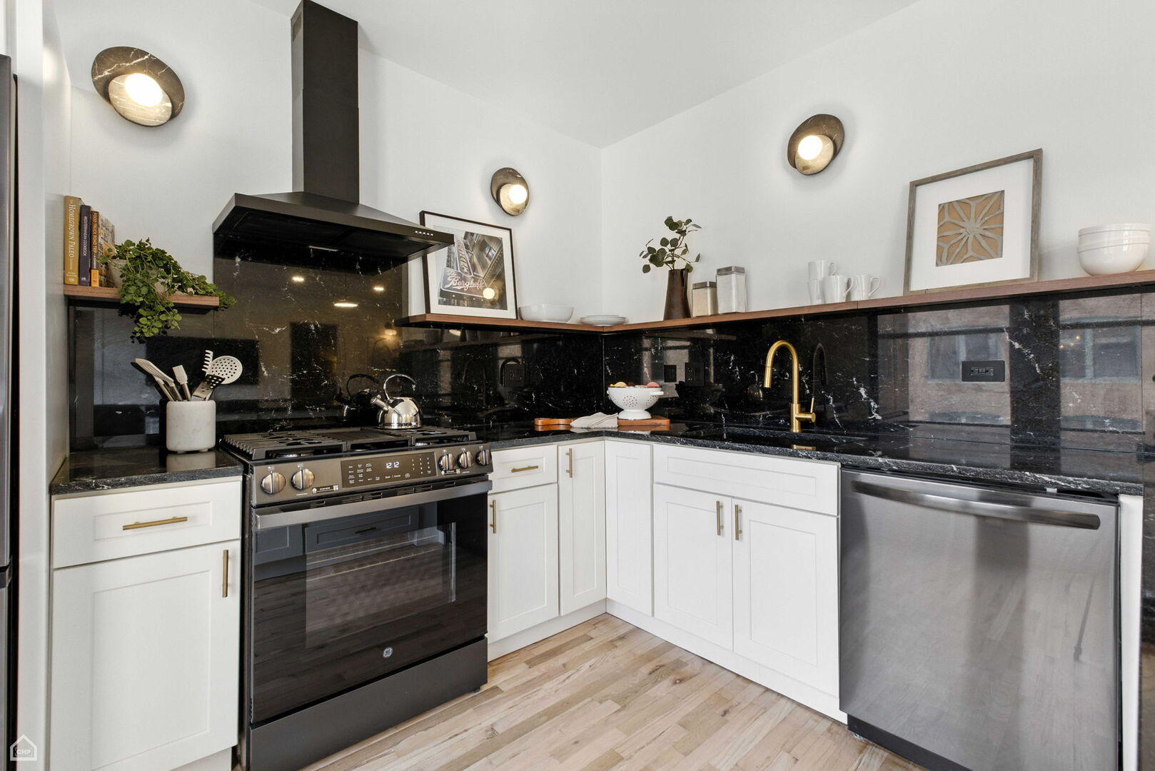 515 North Noble Street, Unit 308 Chicago, IL 60642 - Photo 4 of 13 a kitchen with cabinets and stainless steel appliances