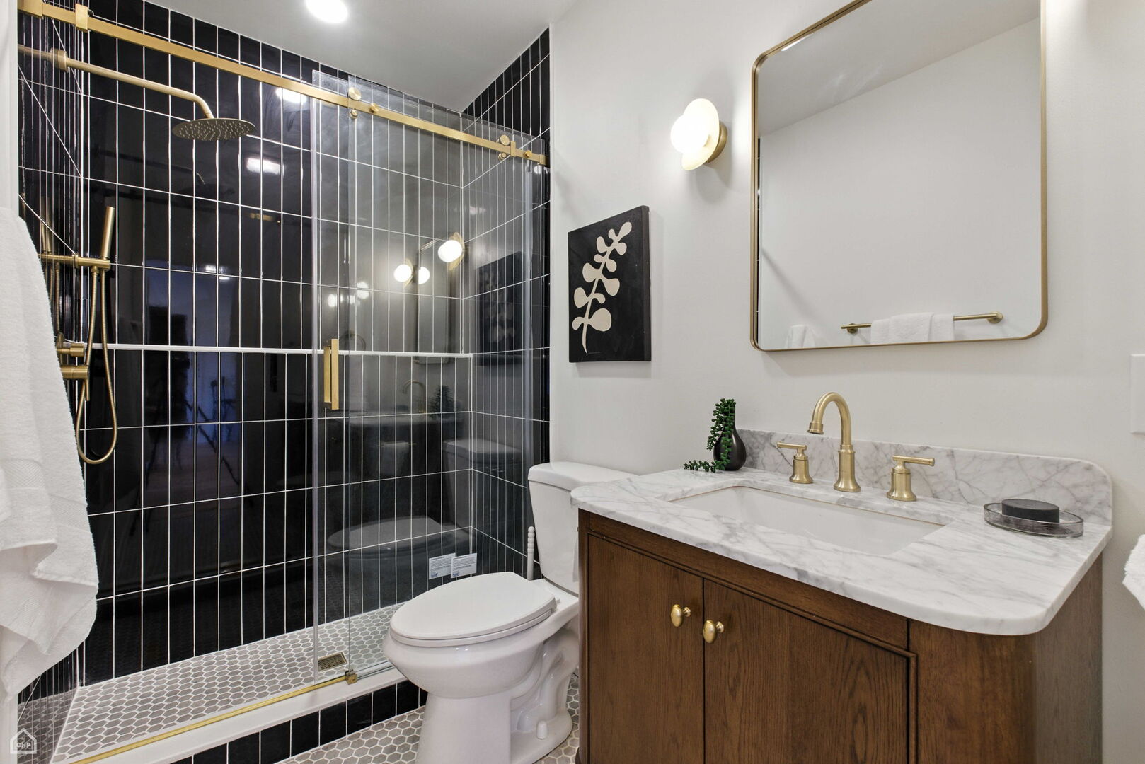 515 North Noble Street, Unit 308 Chicago, IL 60642 - Photo 8 of 13 a bathroom with a sink toilet and shower
