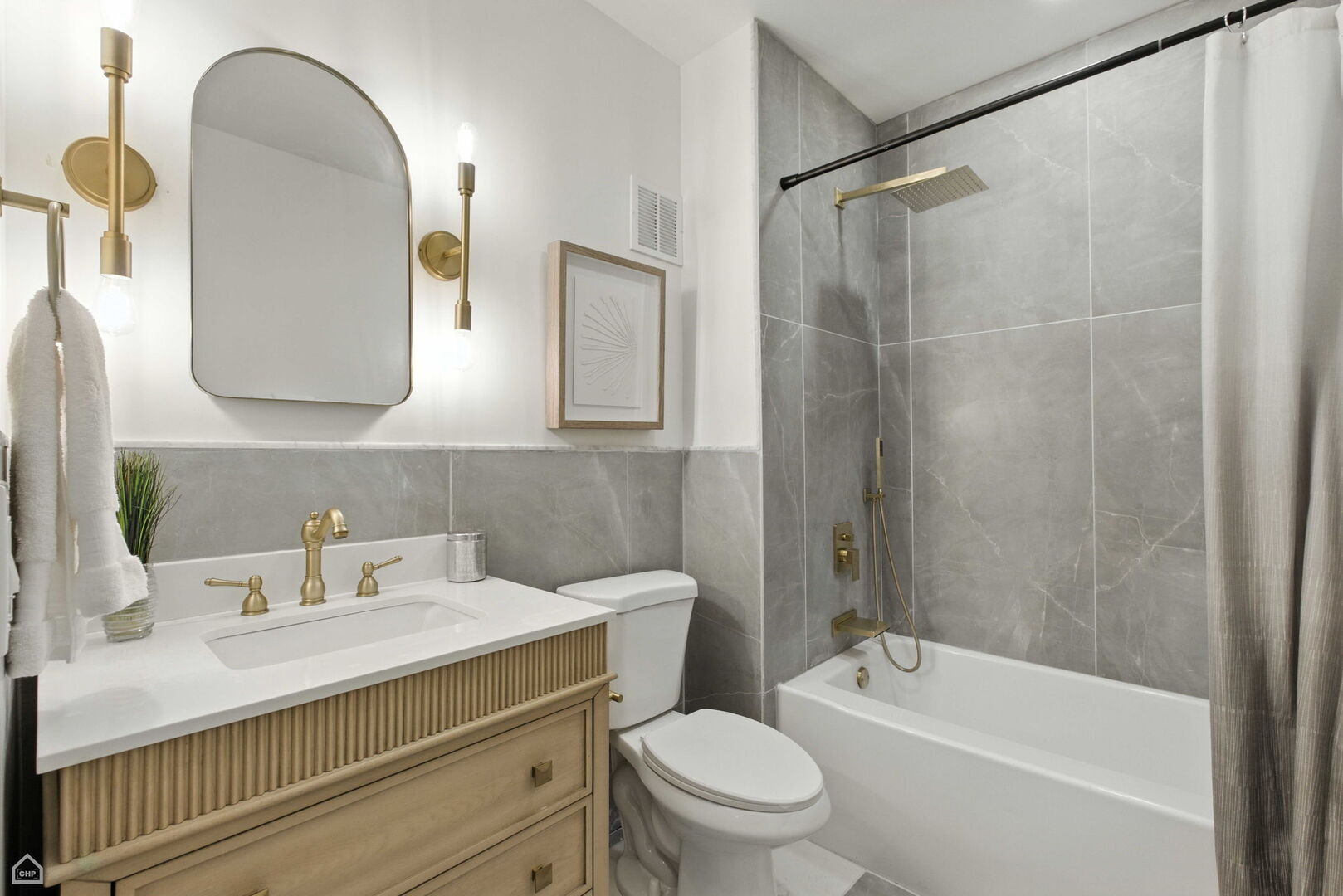 515 North Noble Street, Unit 308 Chicago, IL 60642 - Photo 9 of 13 a bathroom with a sink a toilet and shower