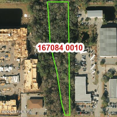 0 Beach Boulevard Jacksonville, FL 32250 - Photo 1 of 15 a front view of multi story residential apartment building with yard
