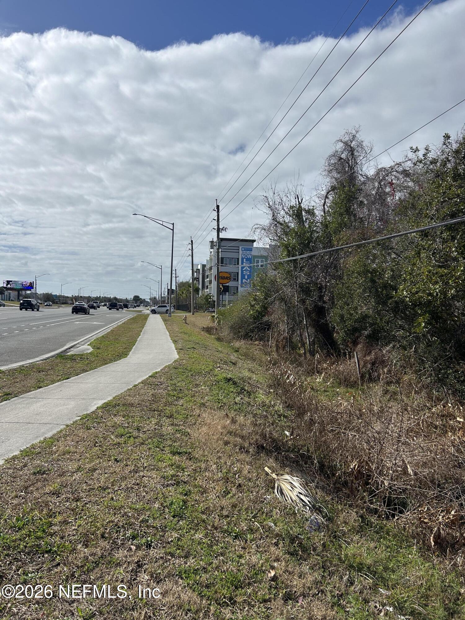 0 Beach Boulevard Jacksonville, FL 32250 - Photo 7 of 15 a view of a dry yard with wooden fence