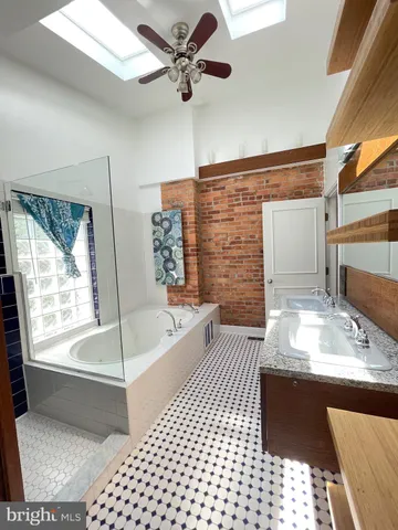 a bathroom with a bathtub and a shower