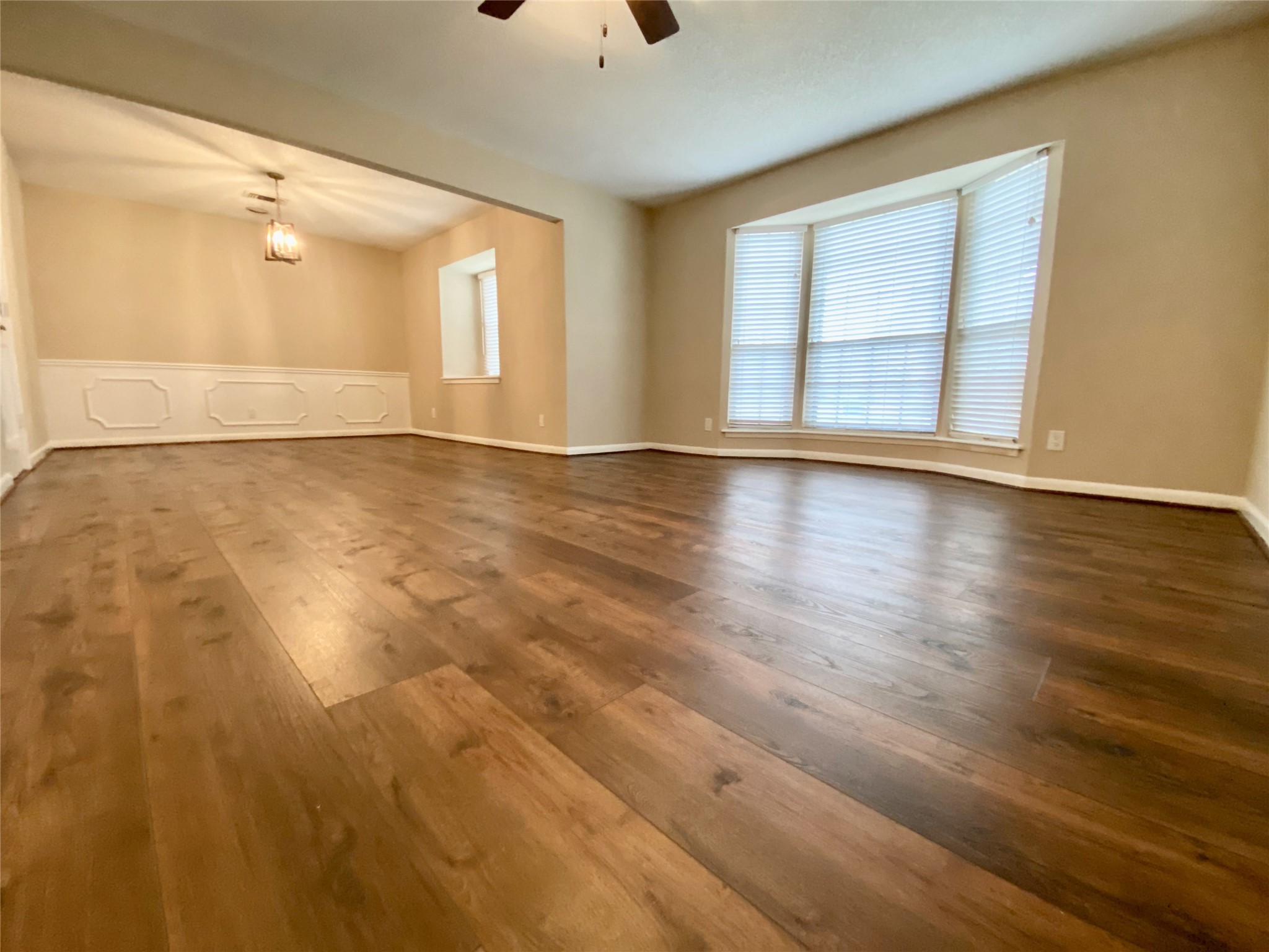 2206 Tannehill Drive Houston, TX 77008 - Photo 11 of 42 an empty room with wooden floor and windows