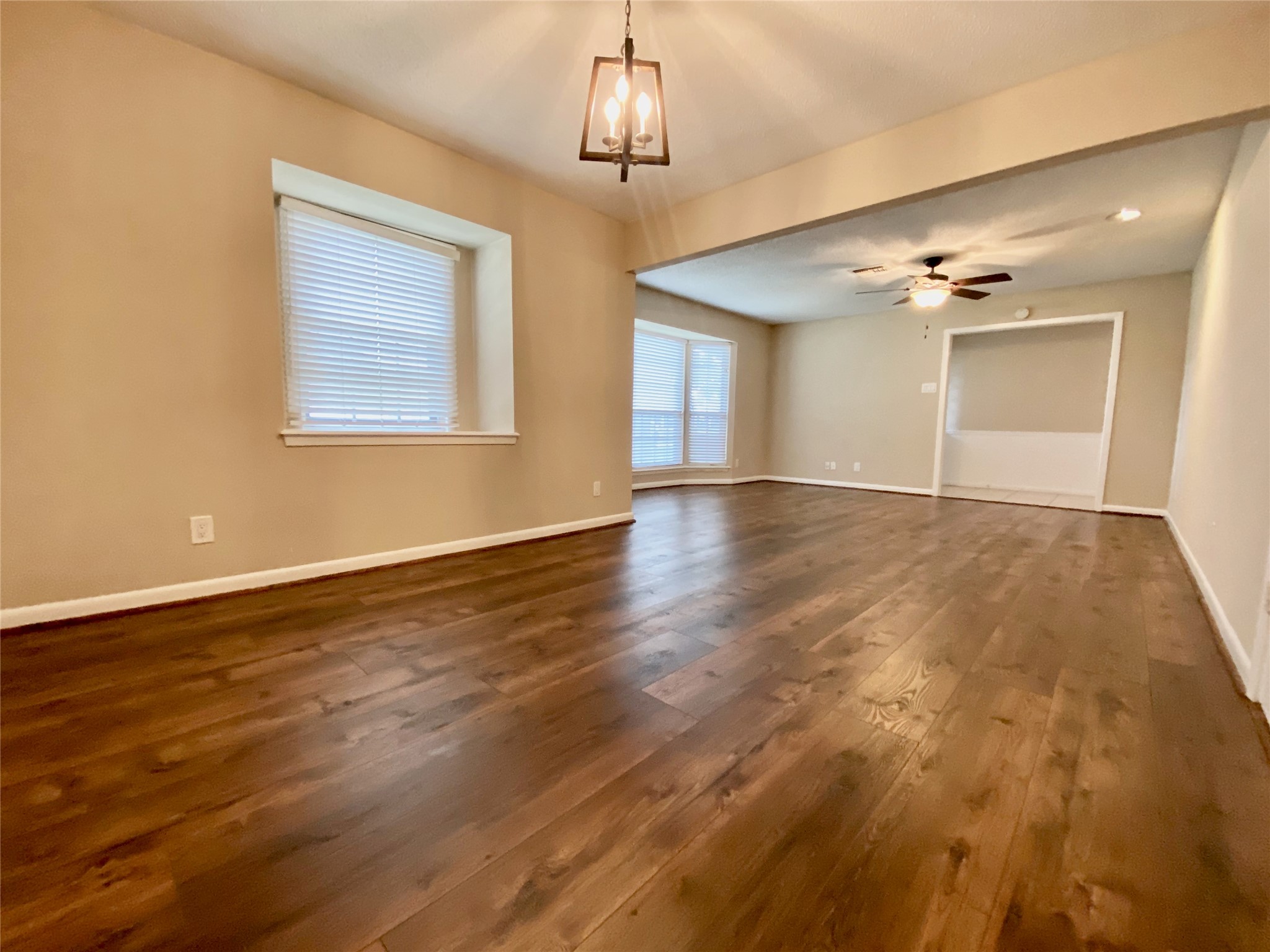 2206 Tannehill Drive Houston, TX 77008 - Photo 12 of 42 a view of an empty room with glass door and a chandelier fan