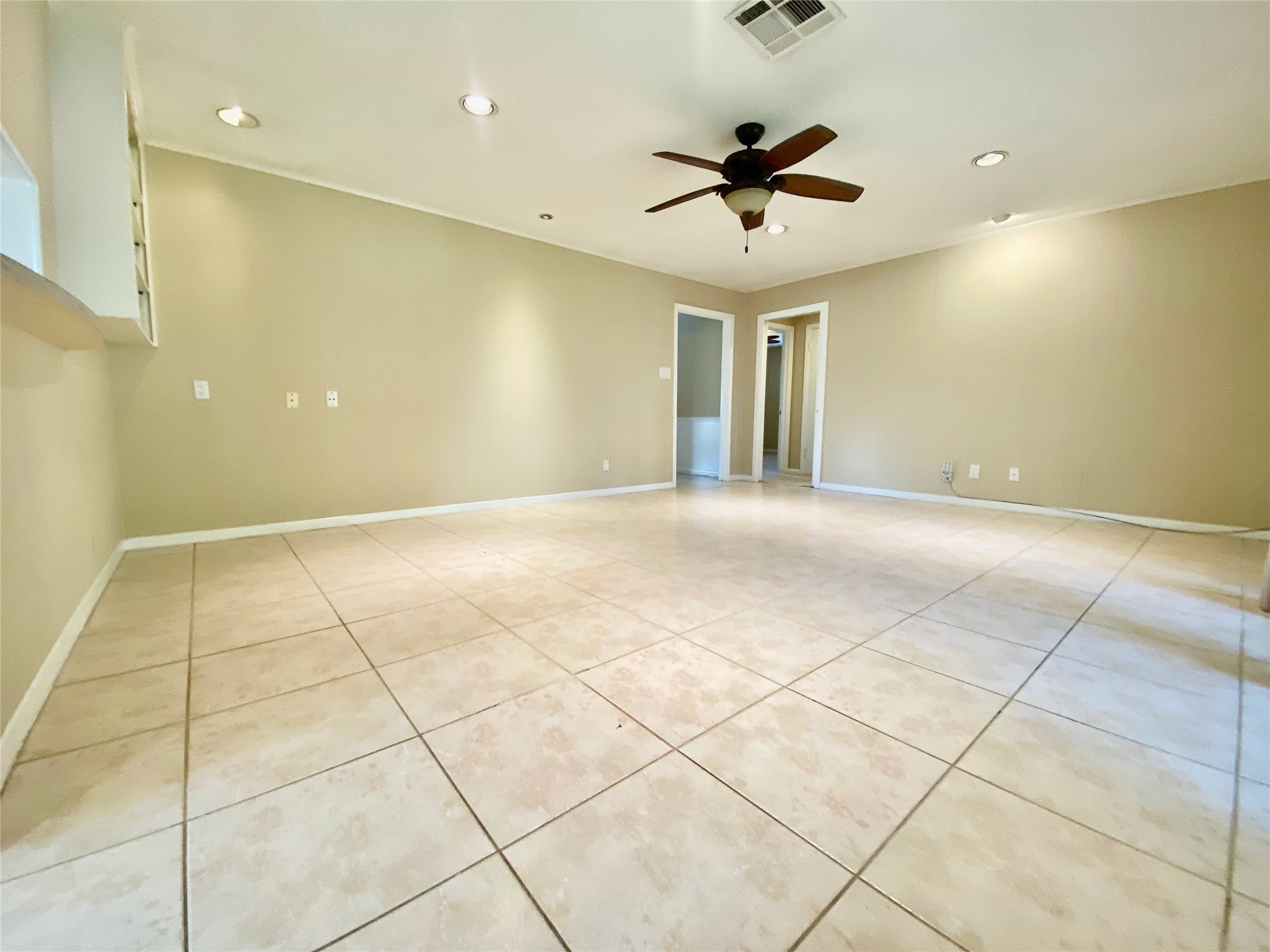2206 Tannehill Drive Houston, TX 77008 - Photo 22 of 42 a view of an empty room and a ceiling fan