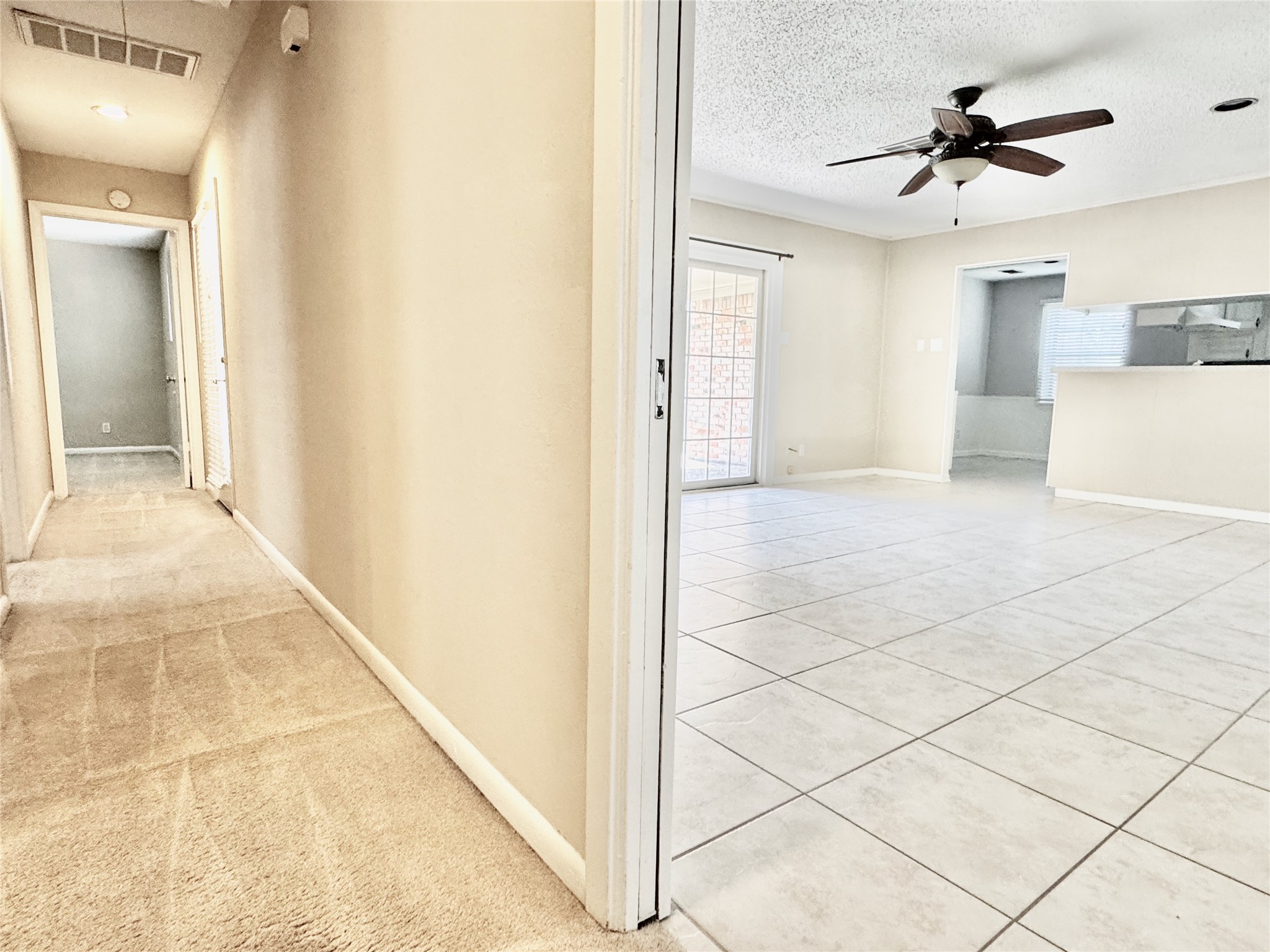 2206 Tannehill Drive Houston, TX 77008 - Photo 25 of 42 a view of a room with a ceiling fan and carpet