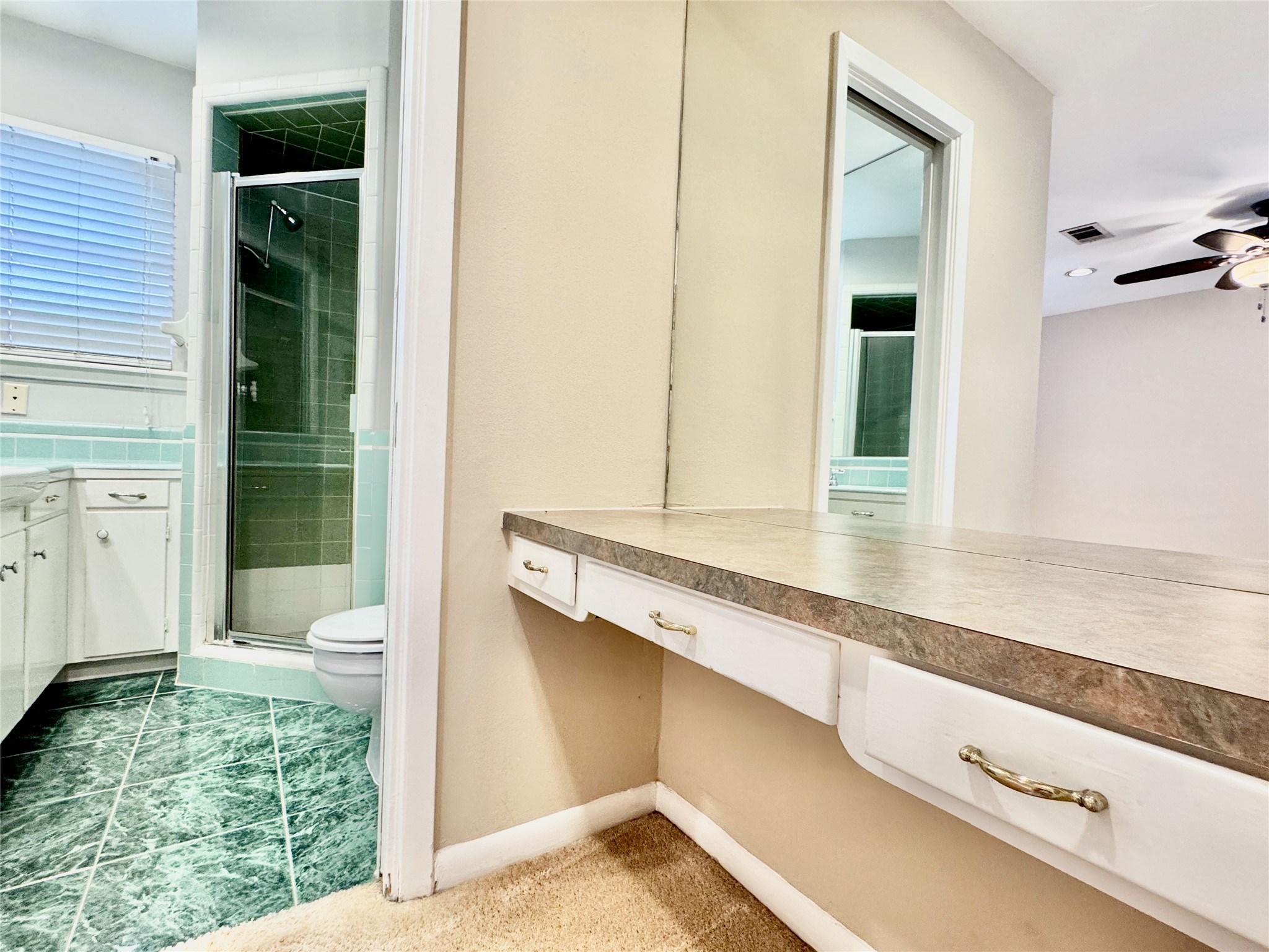 2206 Tannehill Drive Houston, TX 77008 - Photo 28 of 42 a bathroom with a granite countertop sink and a mirror