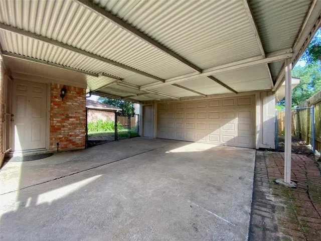 a view of an empty room with a fireplace
