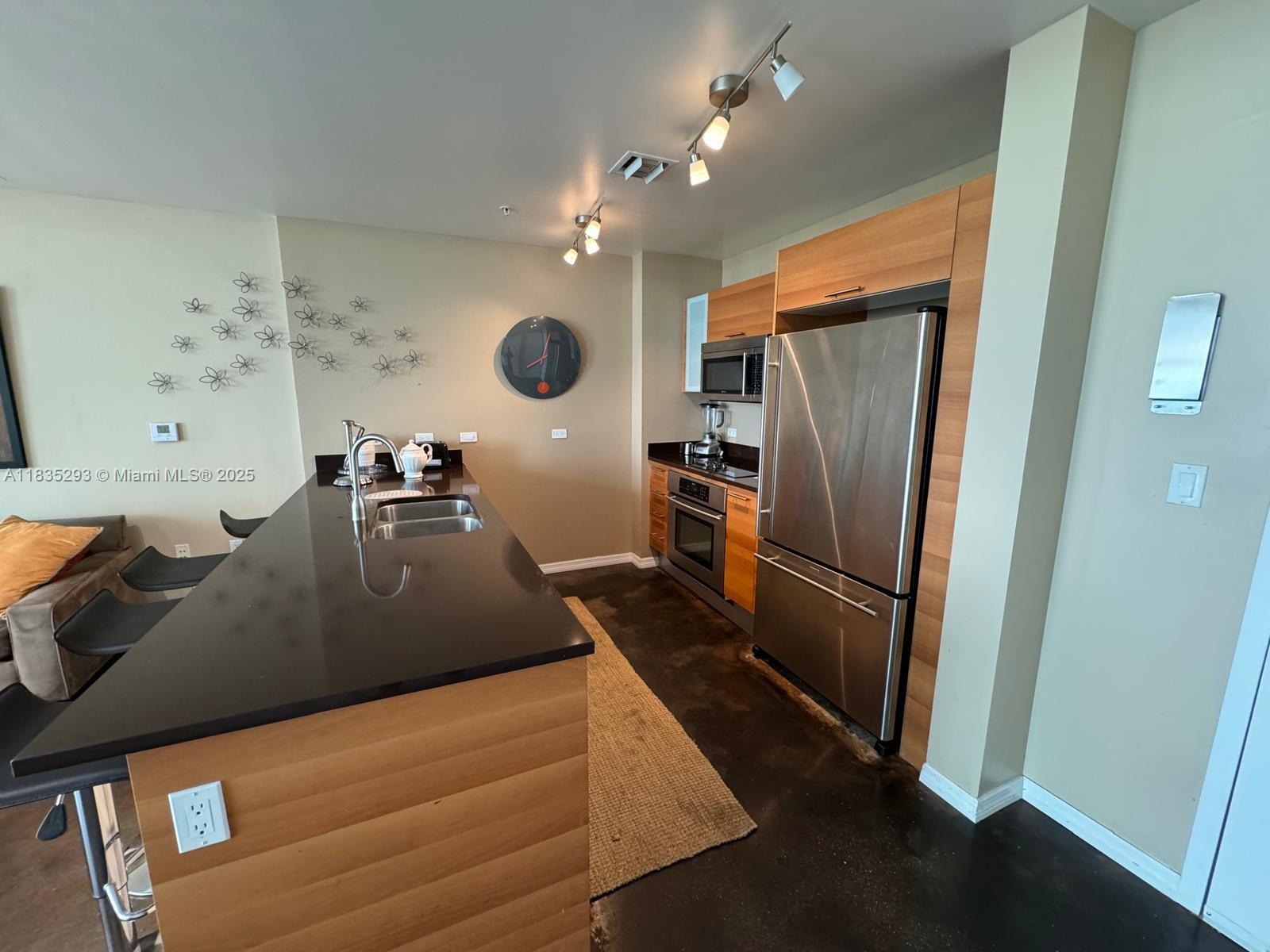 3301 Northeast 1st Avenue, Unit H2903 Miami, FL 33137 - Photo 7 of 20 a view of a living room and a sink