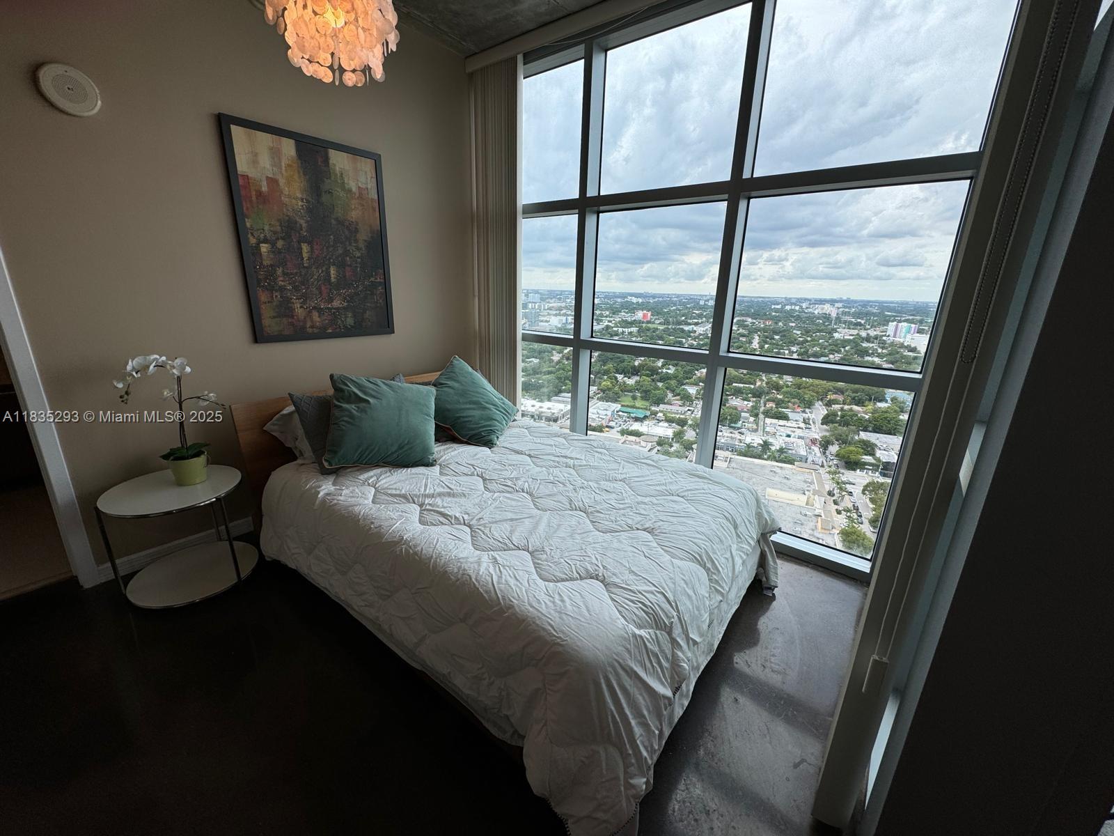 3301 Northeast 1st Avenue, Unit H2903 Miami, FL 33137 - Photo 9 of 20 a bedroom with a bed and a large window
