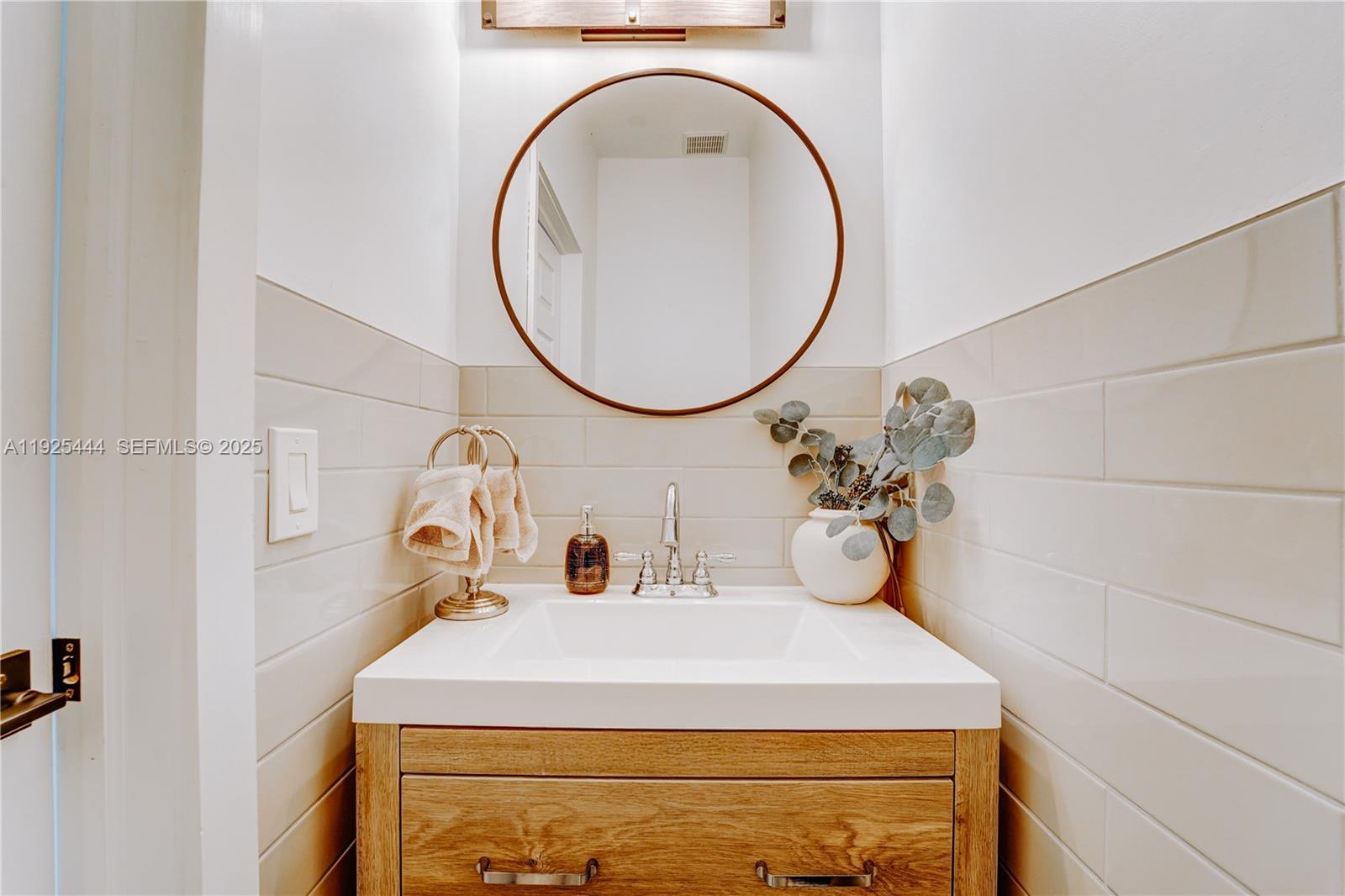 12771 Southwest 133rd Street Miami, FL 33186 - Photo 11 of 39 a bathroom with a sink and a mirror