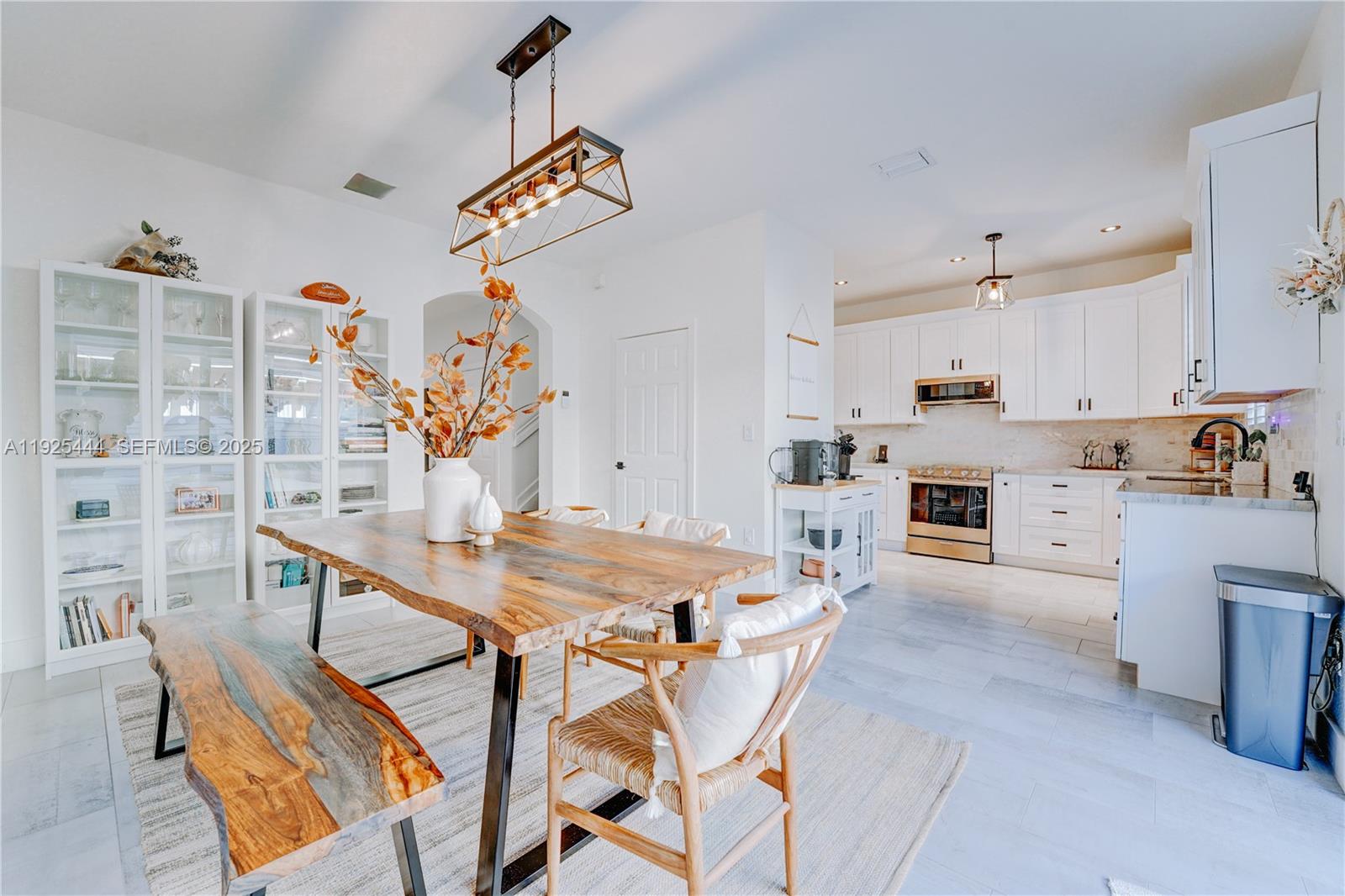 12771 Southwest 133rd Street Miami, FL 33186 - Photo 13 of 39 a view of kitchen with cabinets and wooden floor