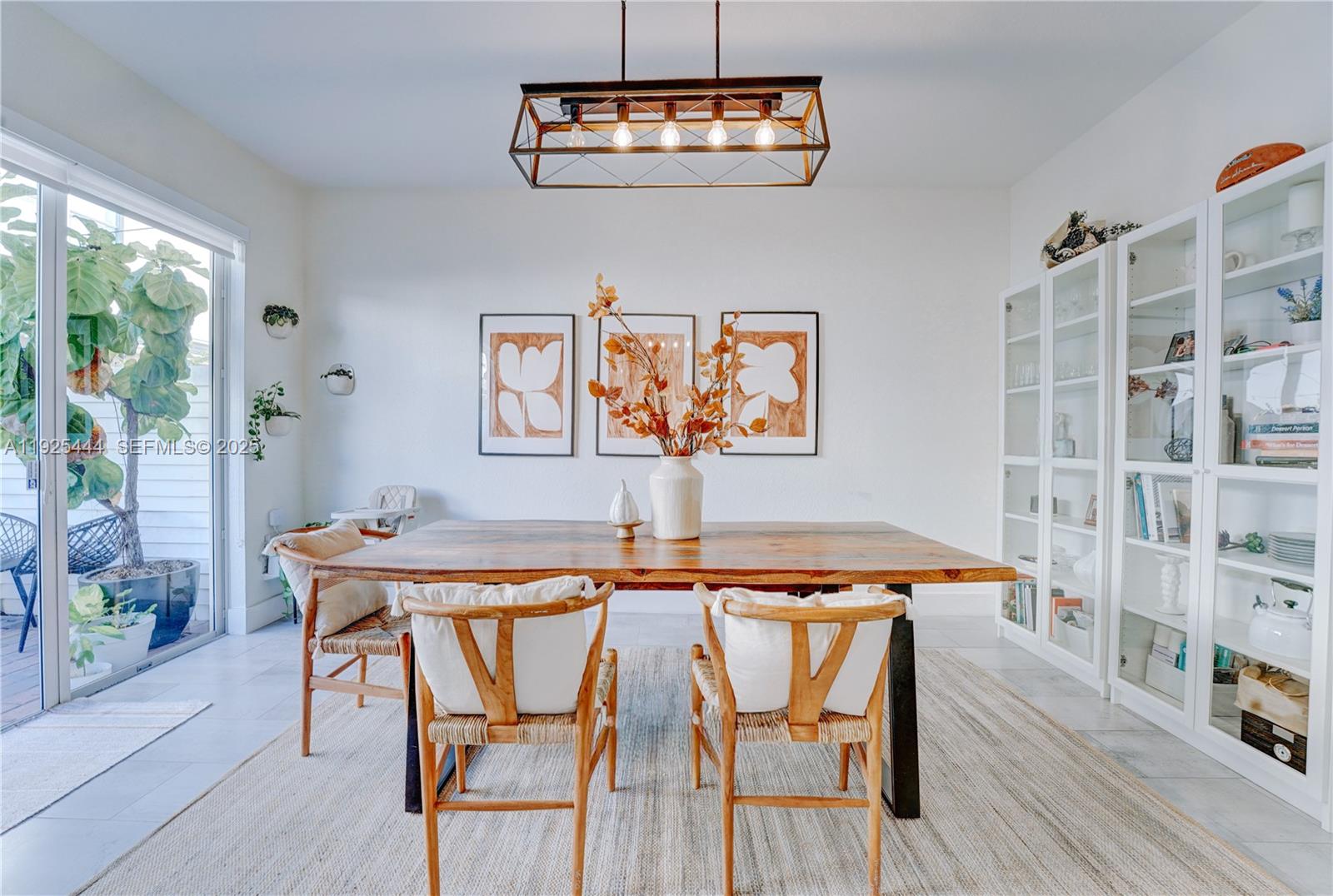 12771 Southwest 133rd Street Miami, FL 33186 - Photo 14 of 39 a view of a dining room with furniture and wooden floor