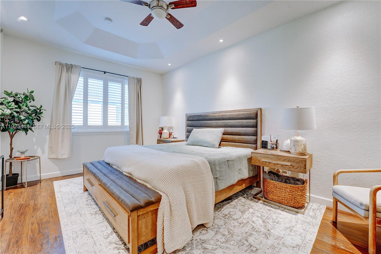 12771 Southwest 133rd Street Miami, FL 33186 - Photo 20 of 39 a bedroom with a bed and a potted plant on the dresser
