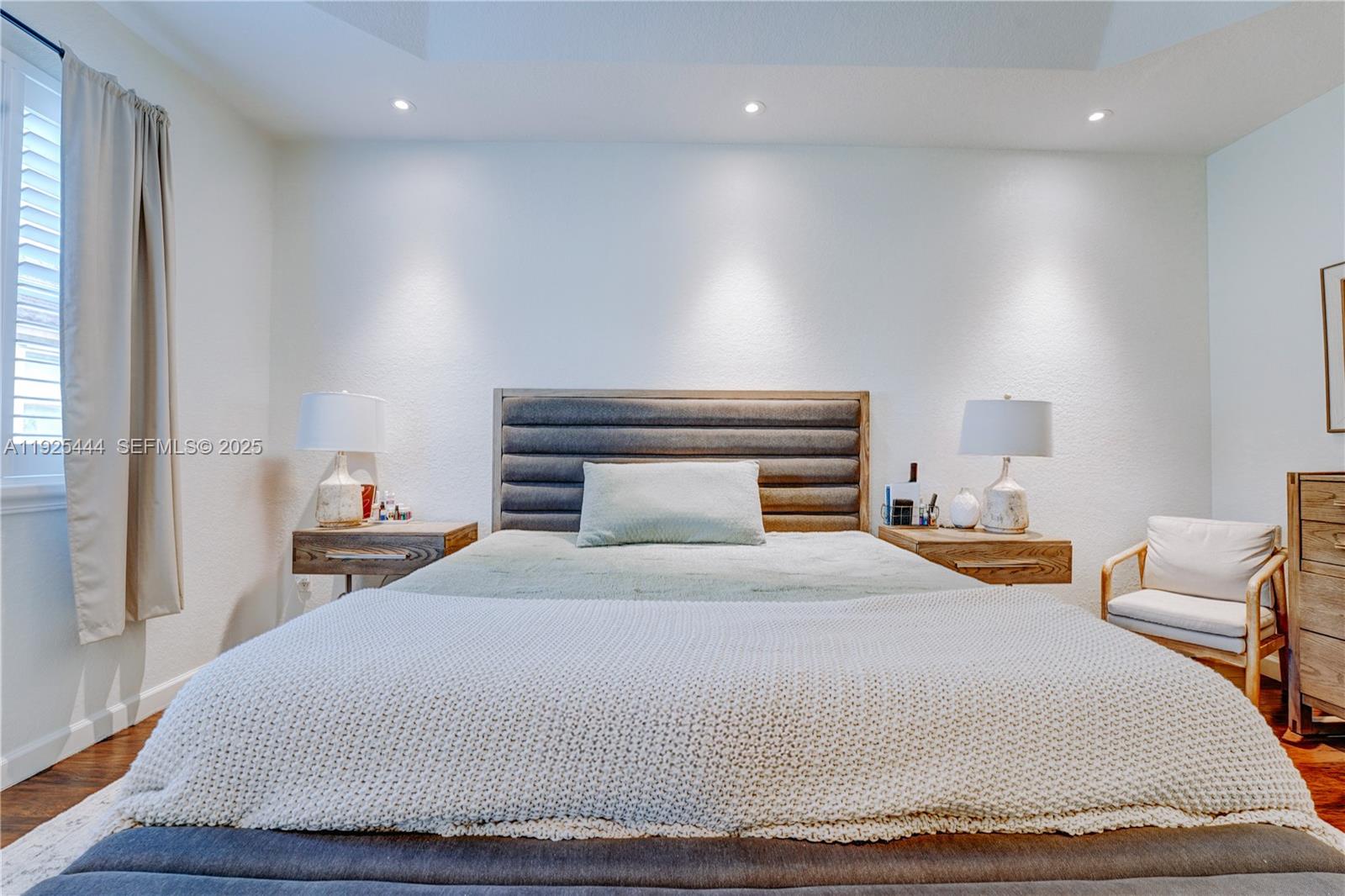 12771 Southwest 133rd Street Miami, FL 33186 - Photo 21 of 39 a bedroom with a bed and window