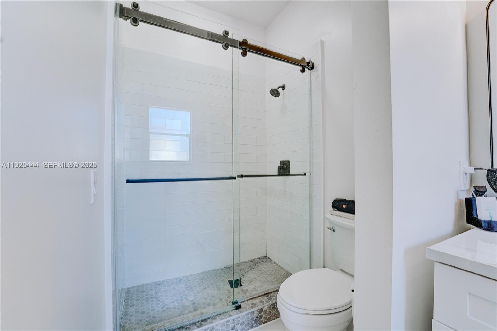 12771 Southwest 133rd Street Miami, FL 33186 - Photo 26 of 39 a bathroom with a toilet and a shower