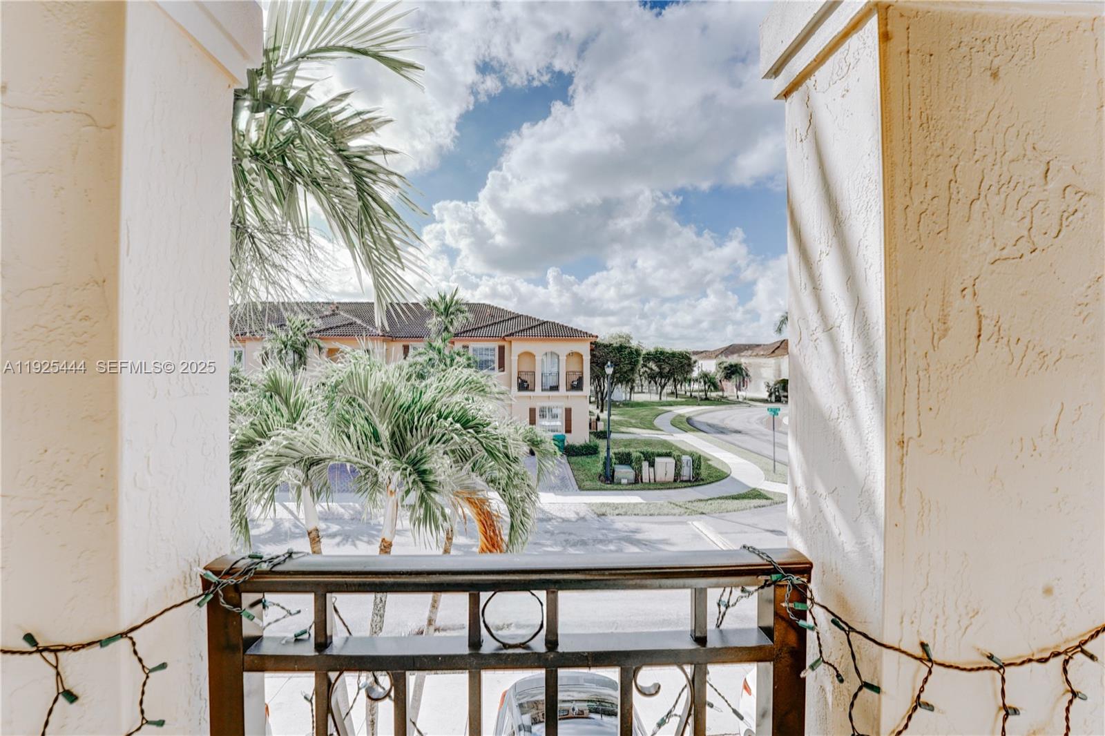 12771 Southwest 133rd Street Miami, FL 33186 - Photo 31 of 39 a view of a balcony with plants and palm trees