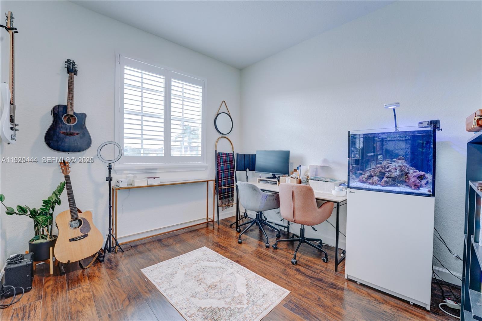12771 Southwest 133rd Street Miami, FL 33186 - Photo 33 of 39 a workspace room with furniture and wooden floor