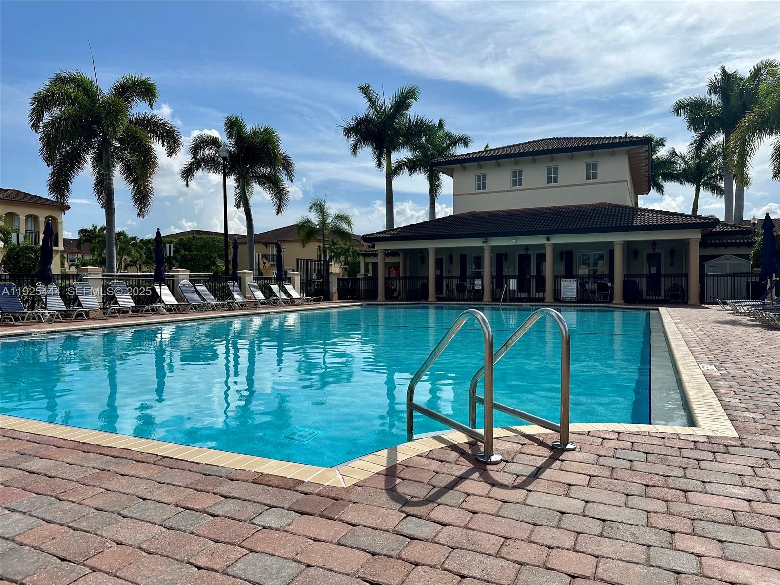 12771 Southwest 133rd Street Miami, FL 33186 - Photo 37 of 39 a swimming pool with outdoor seating and yard