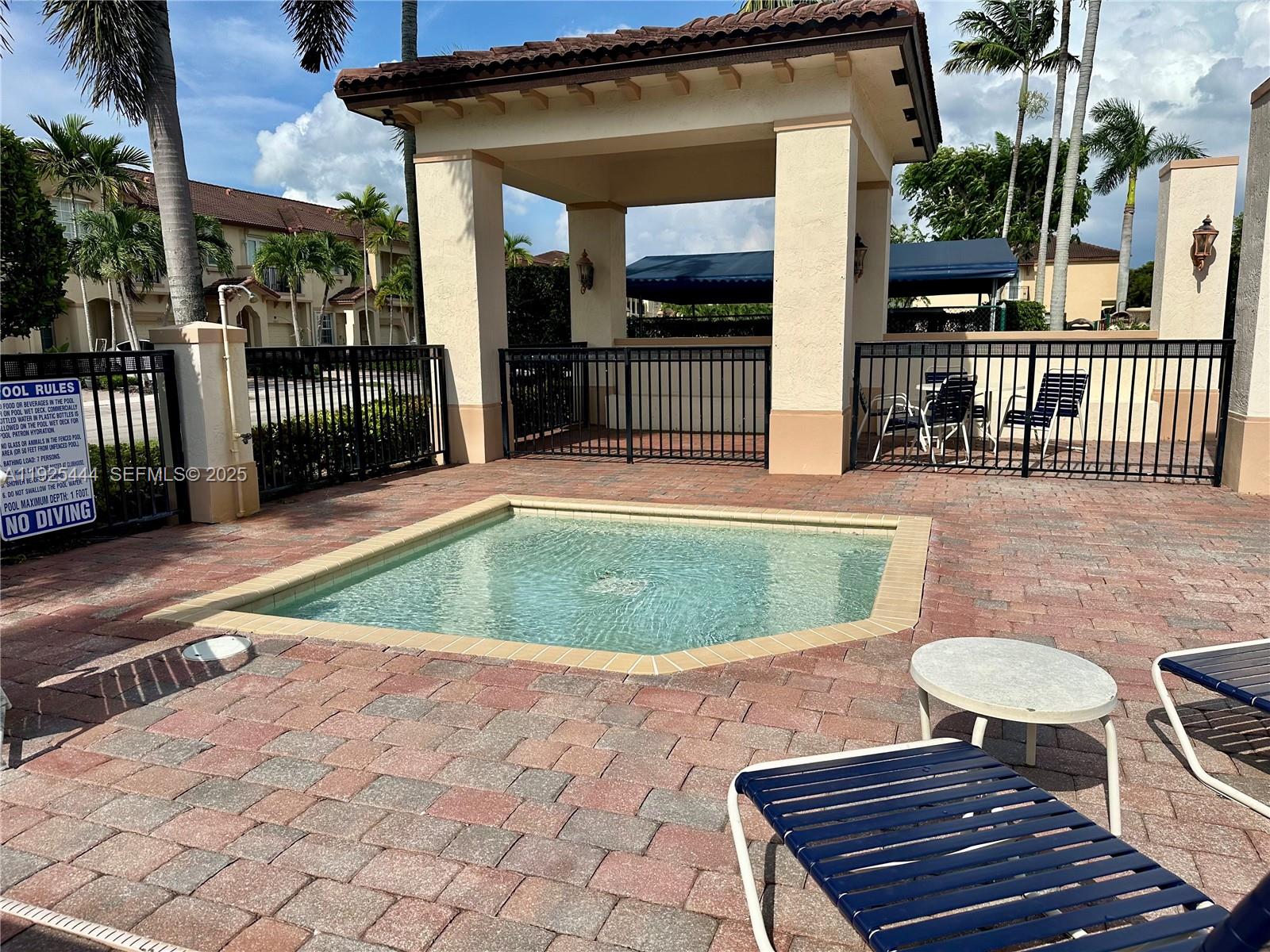 12771 Southwest 133rd Street Miami, FL 33186 - Photo 38 of 39 a view of a chairs and table in th patio