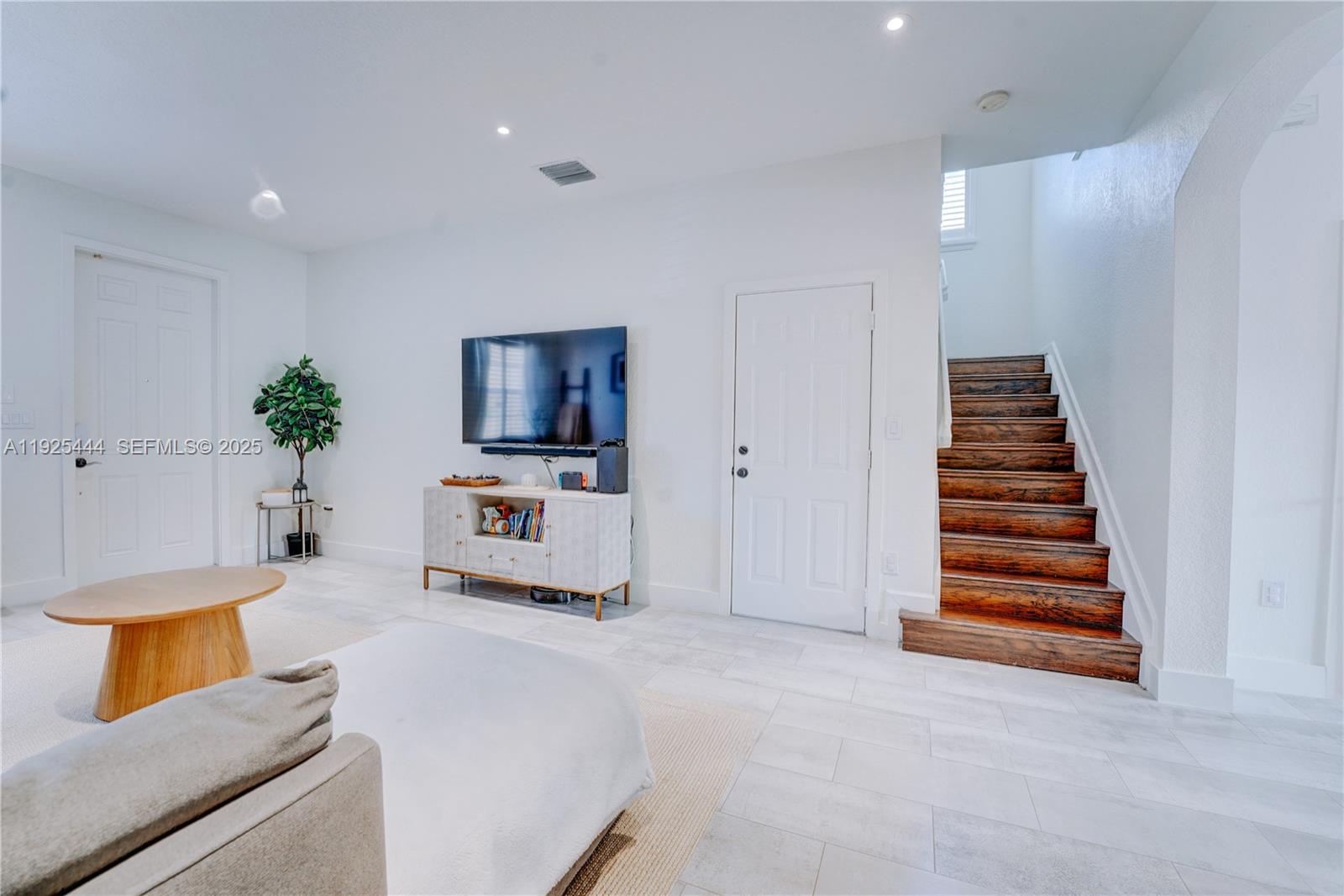 12771 Southwest 133rd Street Miami, FL 33186 - Photo 8 of 39 a living room with furniture and stairs