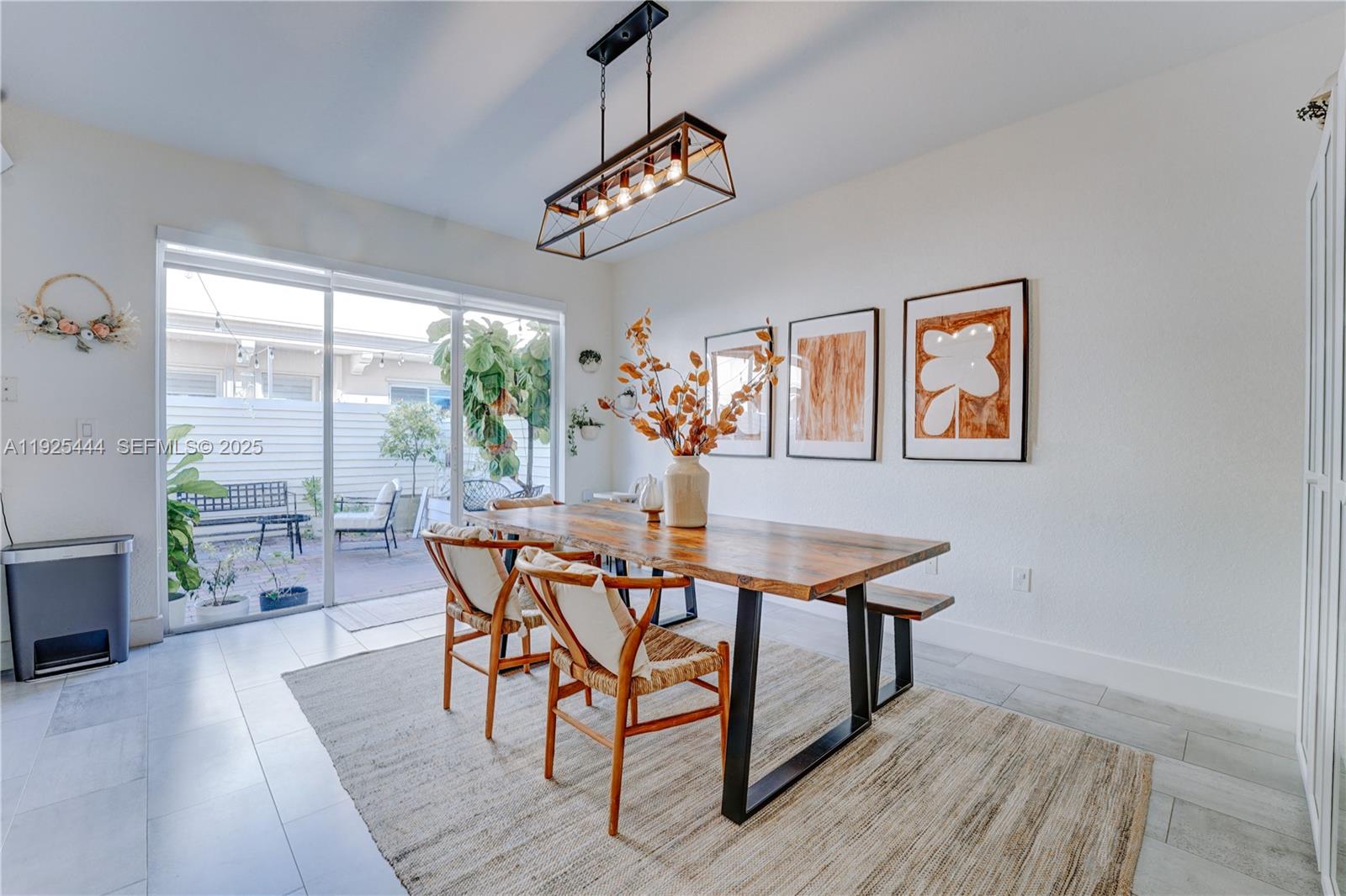 12771 Southwest 133rd Street Miami, FL 33186 - Photo 9 of 39 a view of a dining room with furniture window and wooden floor