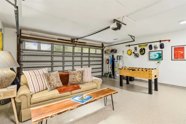 a bedroom with furniture and a rug