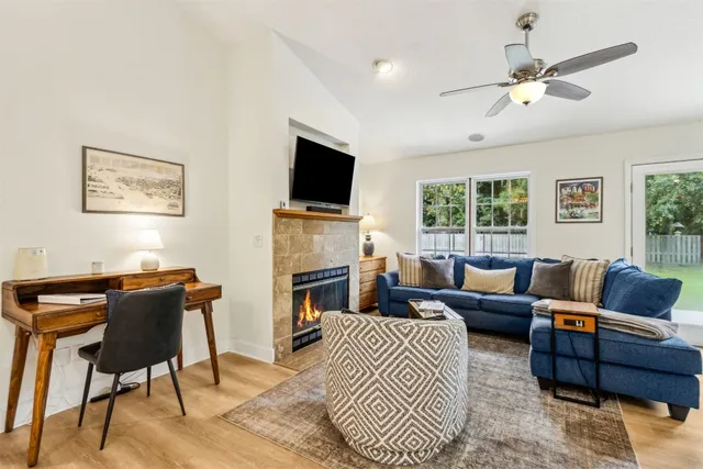 a living room with furniture and a flat screen tv