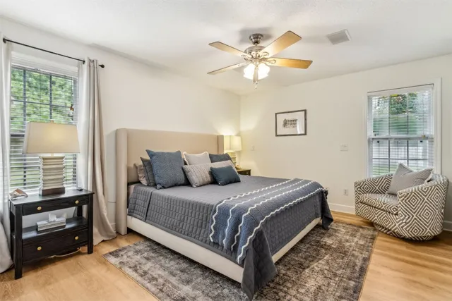 a bedroom with a bed and a couch