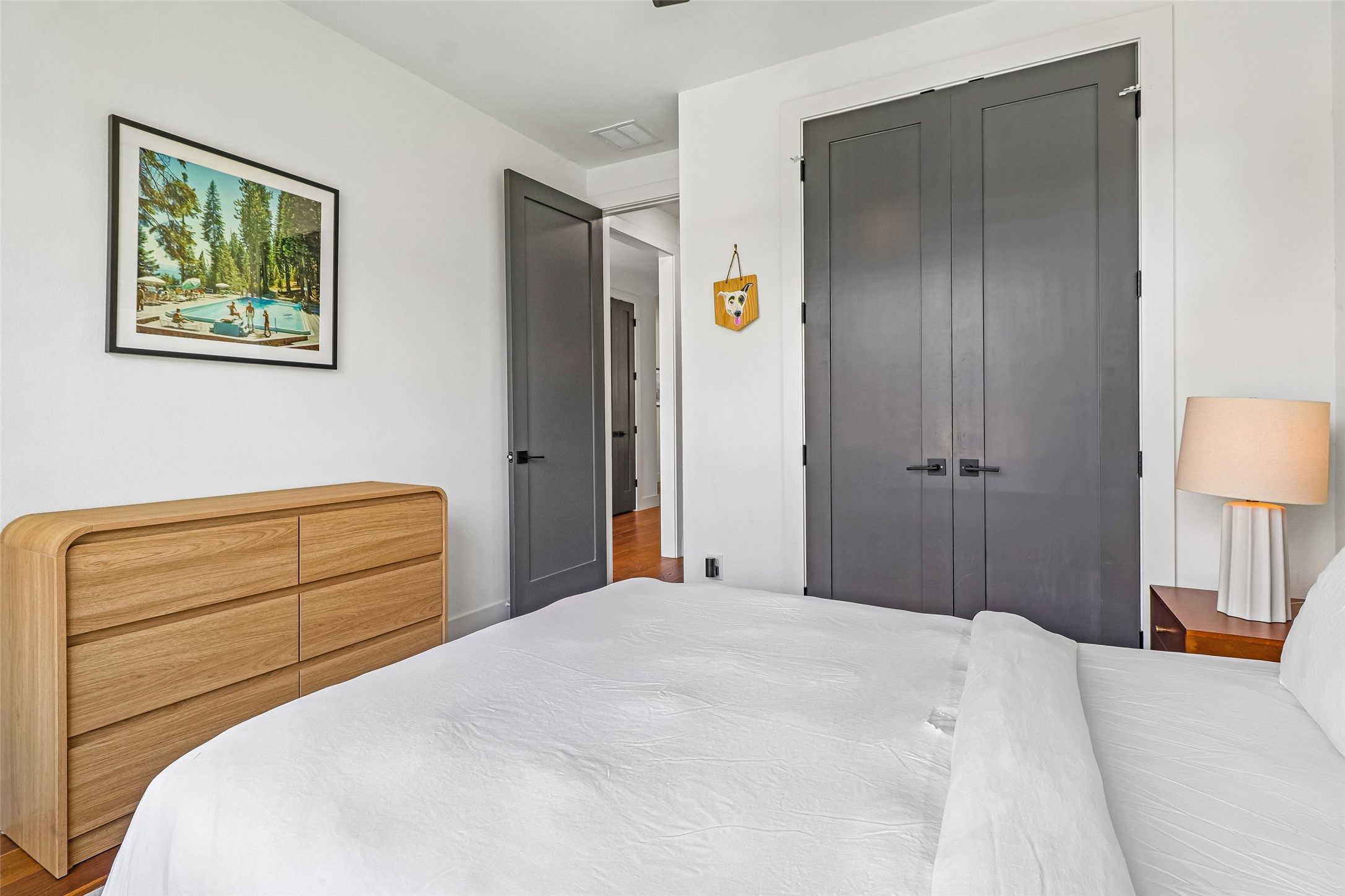 1706 Perez Street, Unit 1 Austin, TX 78721 - Photo 18 of 36 Clean lines define this bedroom's modern aesthetic, offering both style and comfortable repose.