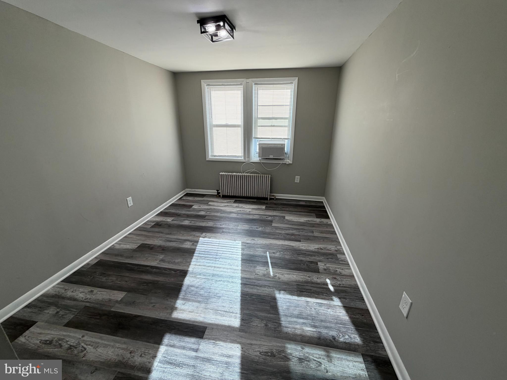 69 Berlin Road, Unit B Clementon, NJ 08021 - Photo 11 of 18 an empty room with wooden floor