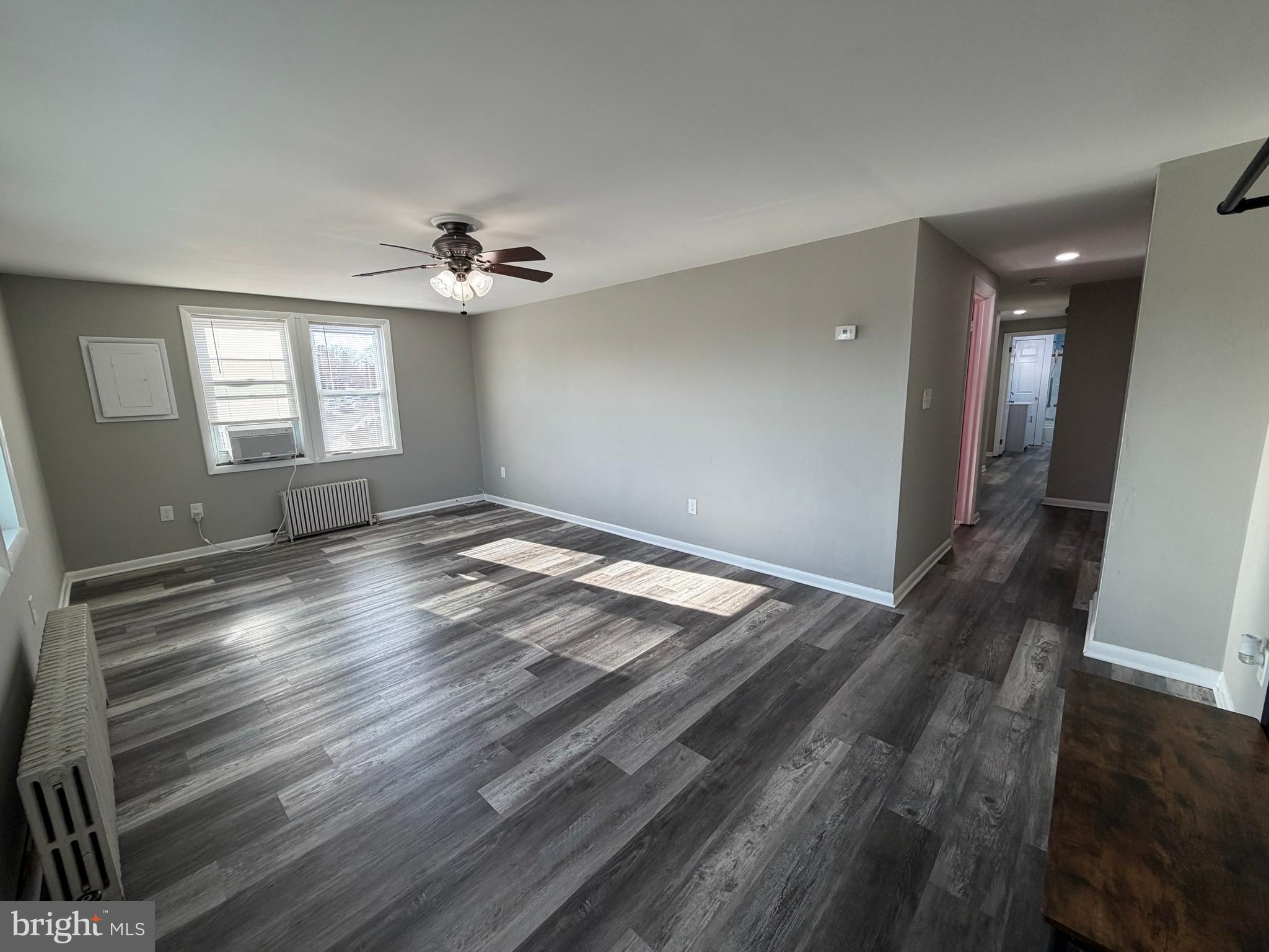 69 Berlin Road, Unit B Clementon, NJ 08021 - Photo 15 of 18 wooden floor in an empty room with a window