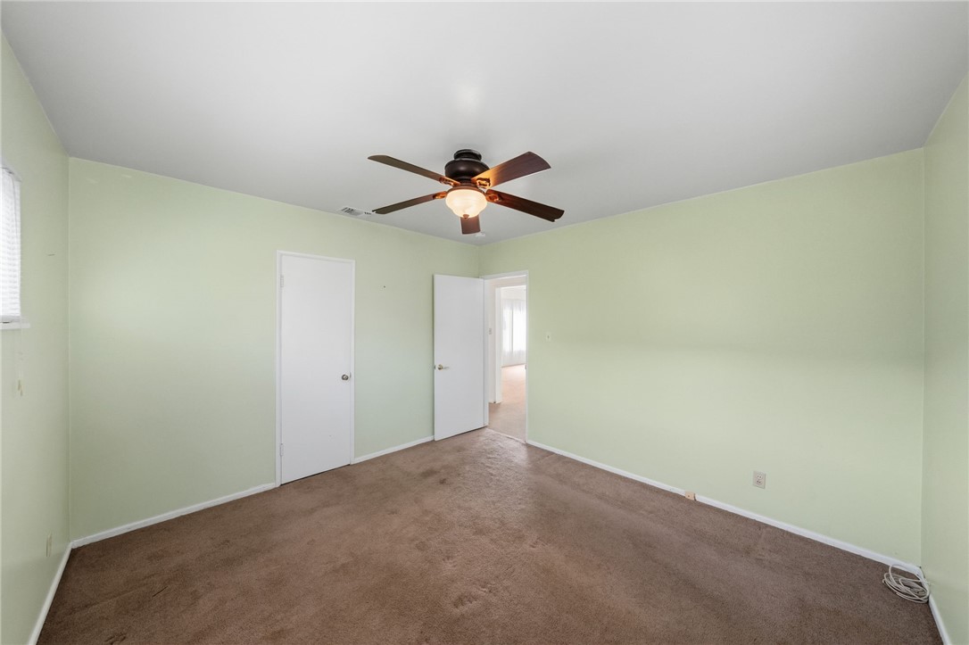 3075 David Street Riverside, CA 92506 - Photo 18 of 40 Additional angle showing generous floor space and closet access, ready for your preferred setup.