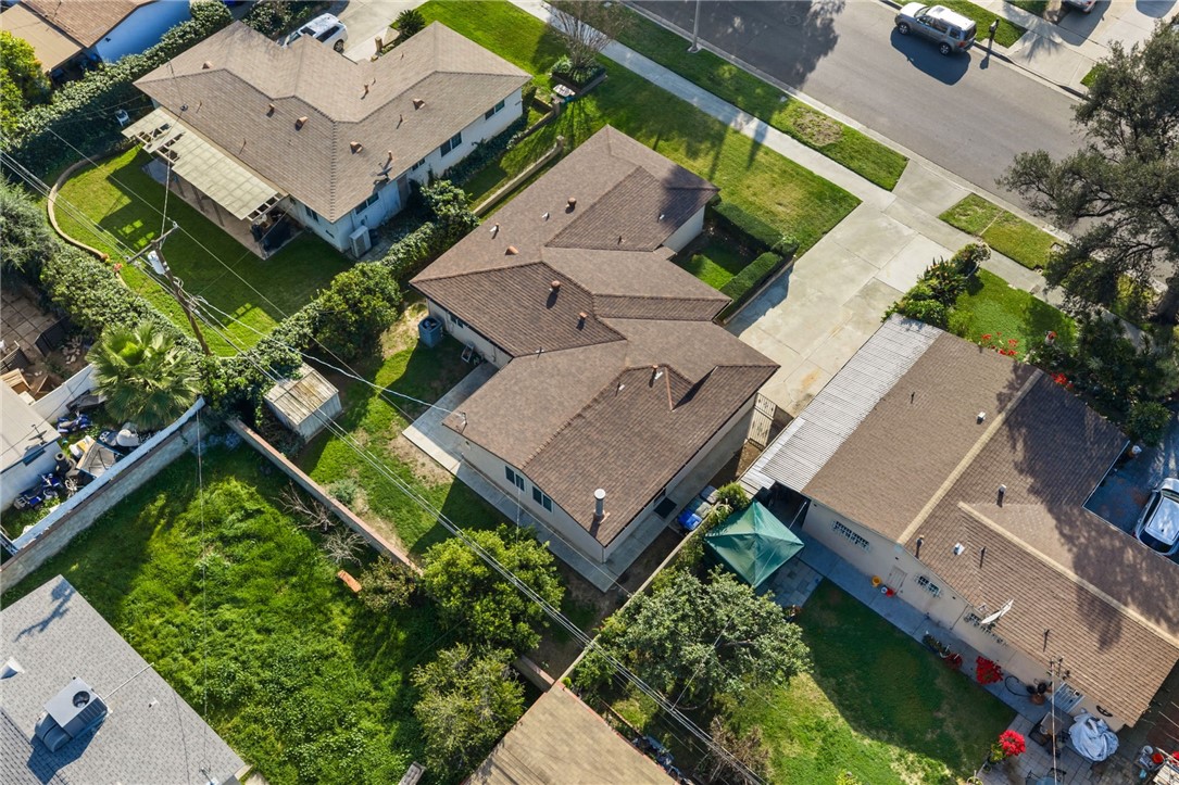 3075 David Street Riverside, CA 92506 - Photo 3 of 40 Overhead perspective showcasing the home’s roofline, yard space, and surrounding neighborhood streetscape.