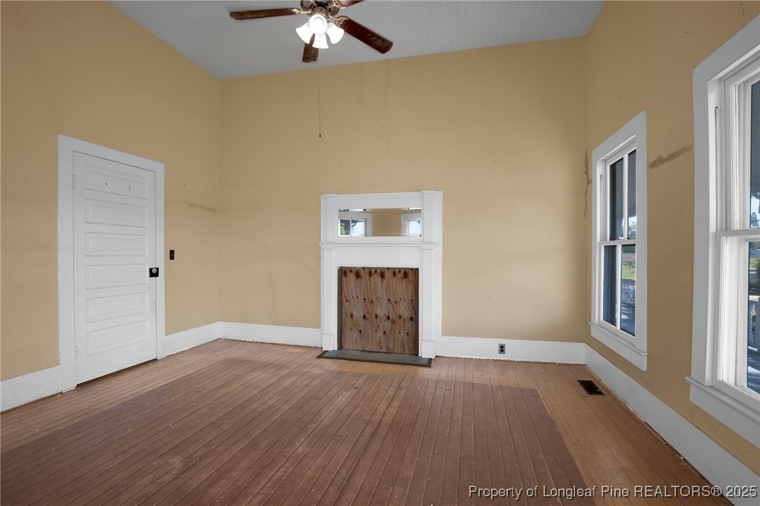 5125 Maxwell Road Autryville, NC 28318 - Photo 11 of 37 wooden floor in an empty room with a window