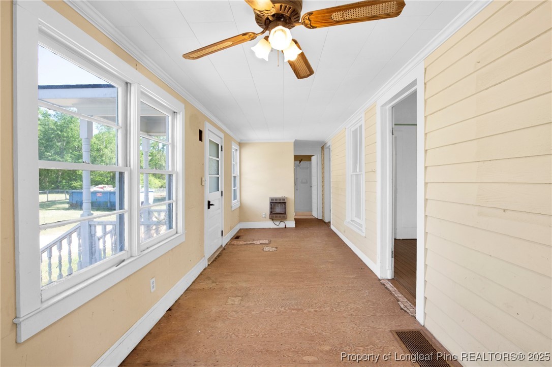 5125 Maxwell Road Autryville, NC 28318 - Photo 14 of 37 a view of a hallway with windows