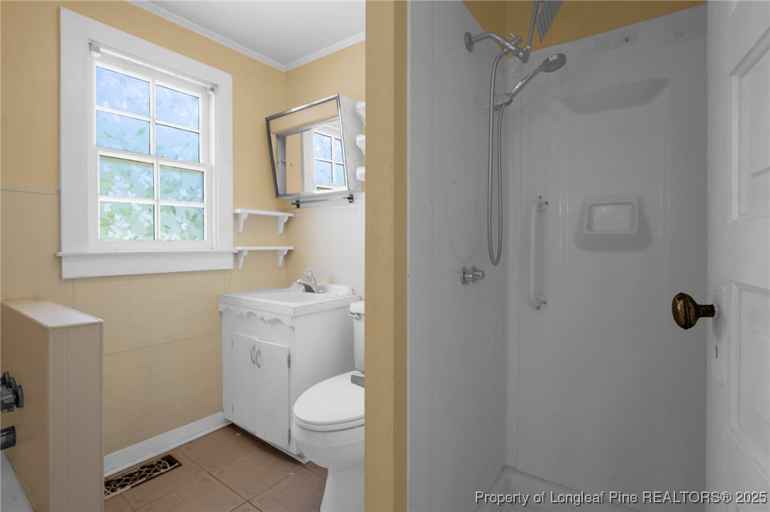 5125 Maxwell Road Autryville, NC 28318 - Photo 15 of 37 a bathroom with a sink a toilet and shower