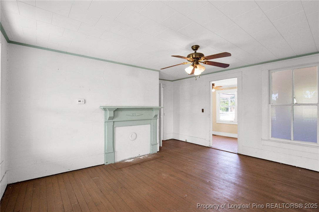 5125 Maxwell Road Autryville, NC 28318 - Photo 18 of 37 an empty room with cabinet and a ceiling fan