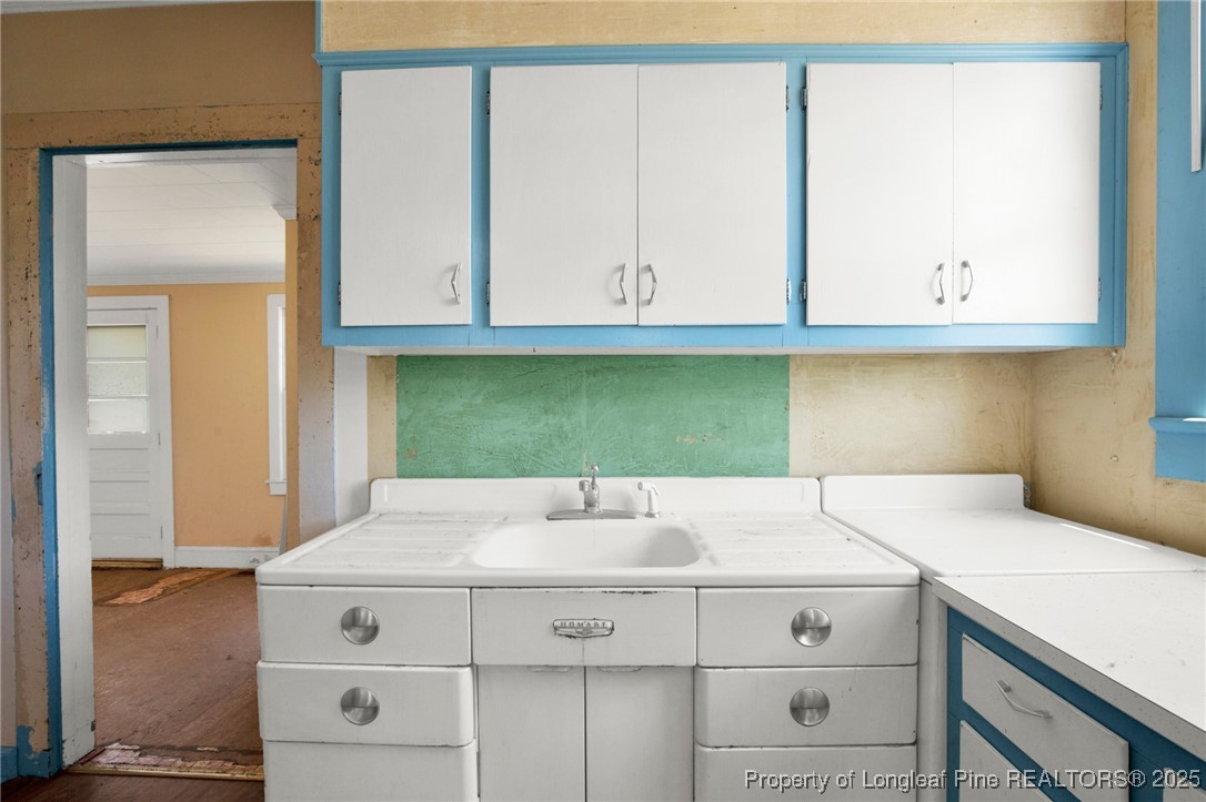 5125 Maxwell Road Autryville, NC 28318 - Photo 22 of 37 a kitchen with a sink and cabinets