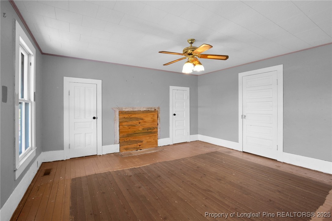 5125 Maxwell Road Autryville, NC 28318 - Photo 27 of 37 a view of an empty room with window and wooden floor
