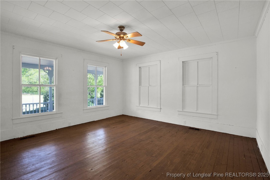 5125 Maxwell Road Autryville, NC 28318 - Photo 28 of 37 a view of an empty room with wooden floor and window
