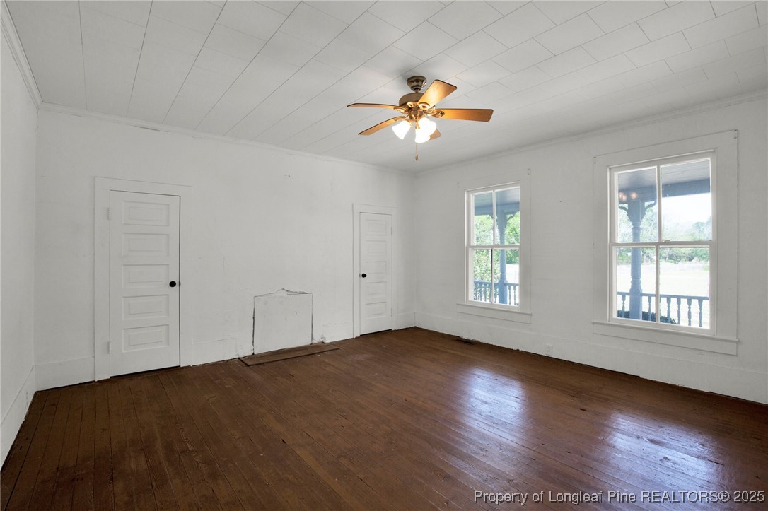 5125 Maxwell Road Autryville, NC 28318 - Photo 29 of 37 a view of an empty room with wooden floor and window