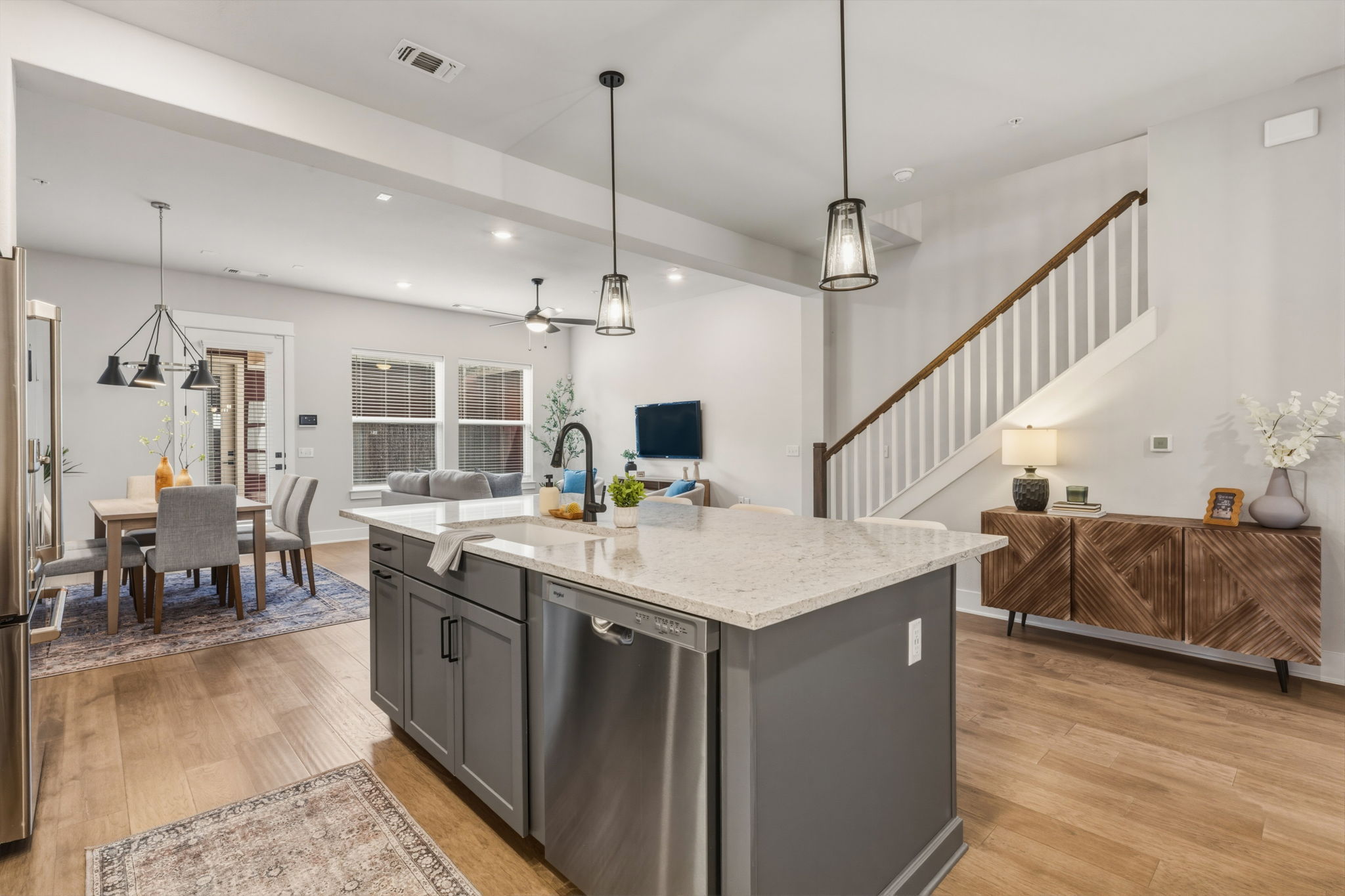 2929 Moreno Street Austin, TX 78723 - Photo 12 of 40 Spacious kitchen island with light-toned countertop, integrated stainless steel dishwasher, and matte black faucet