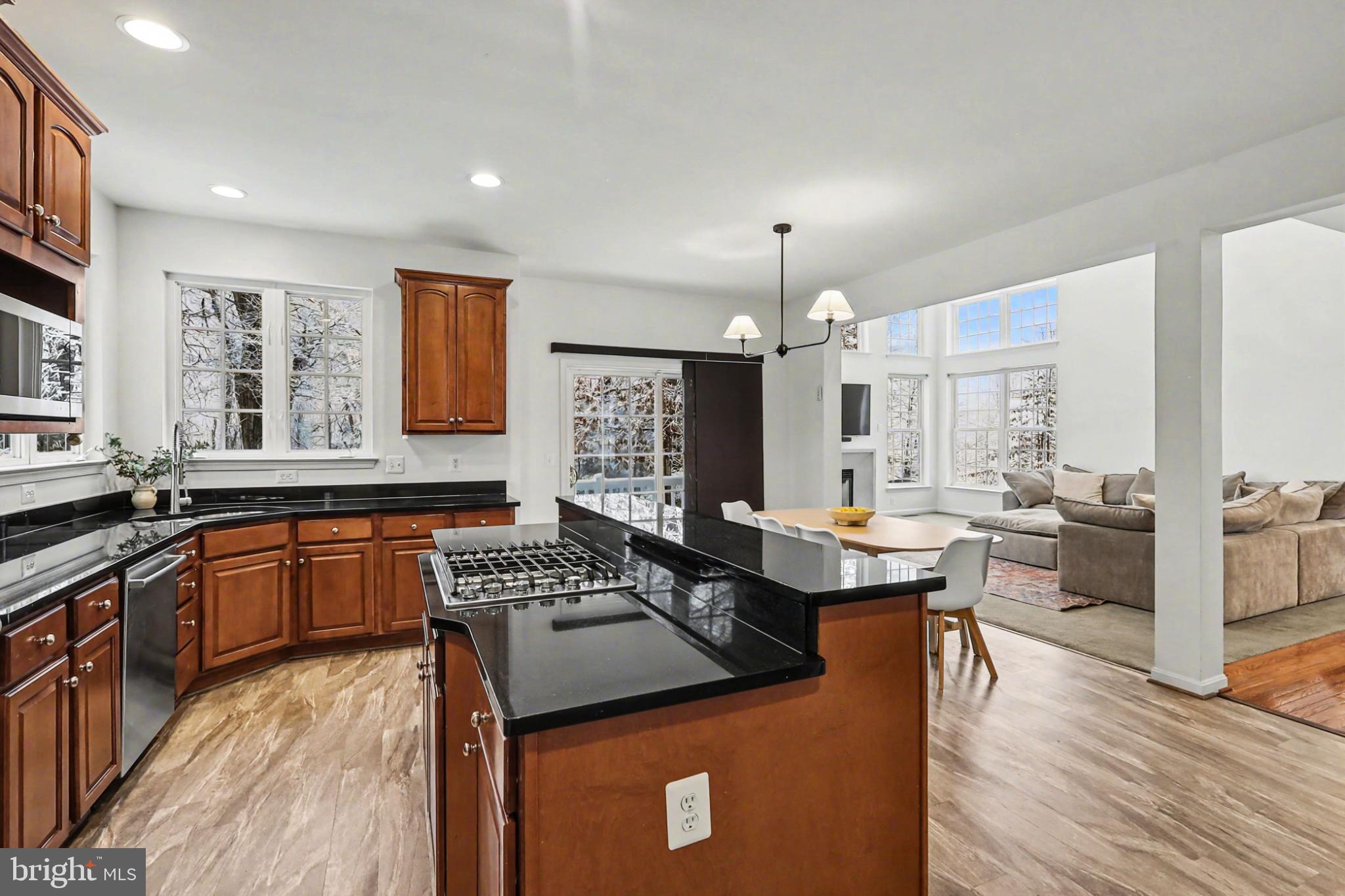 19201 Buna Street Triangle, VA 22172 - Photo 22 of 69 Modern kitchen with elegant wood accents.