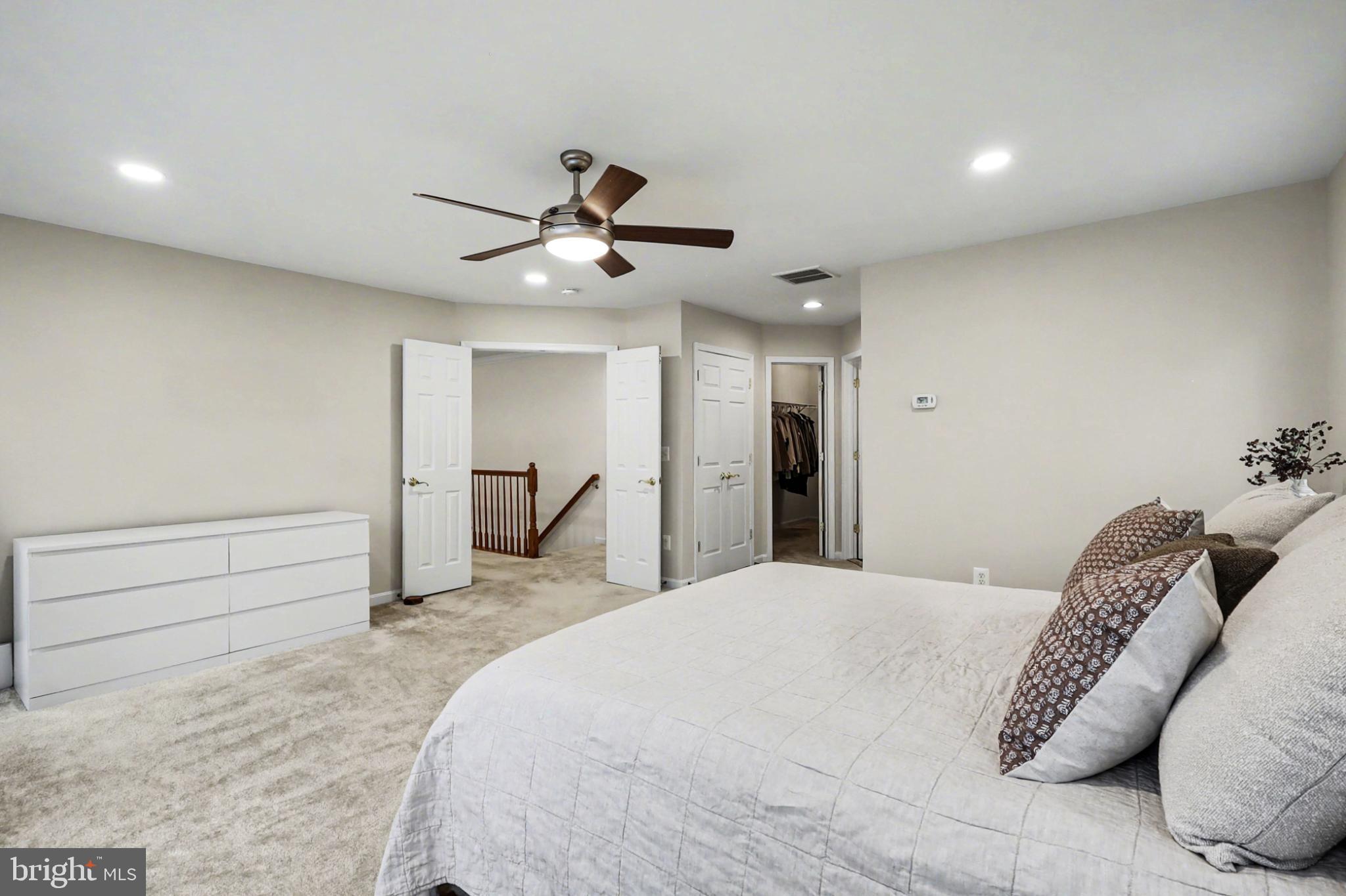 19201 Buna Street Triangle, VA 22172 - Photo 37 of 69 Spacious bedroom with modern elegance.