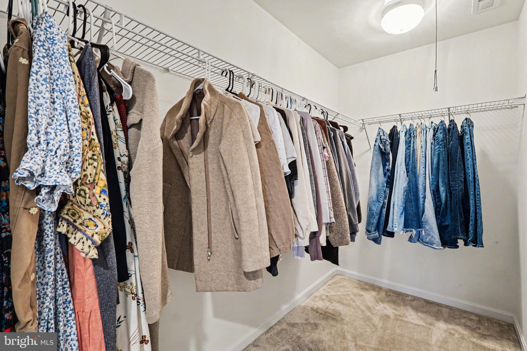 19201 Buna Street Triangle, VA 22172 - Photo 40 of 69 Stylish closet with organized clothing racks.