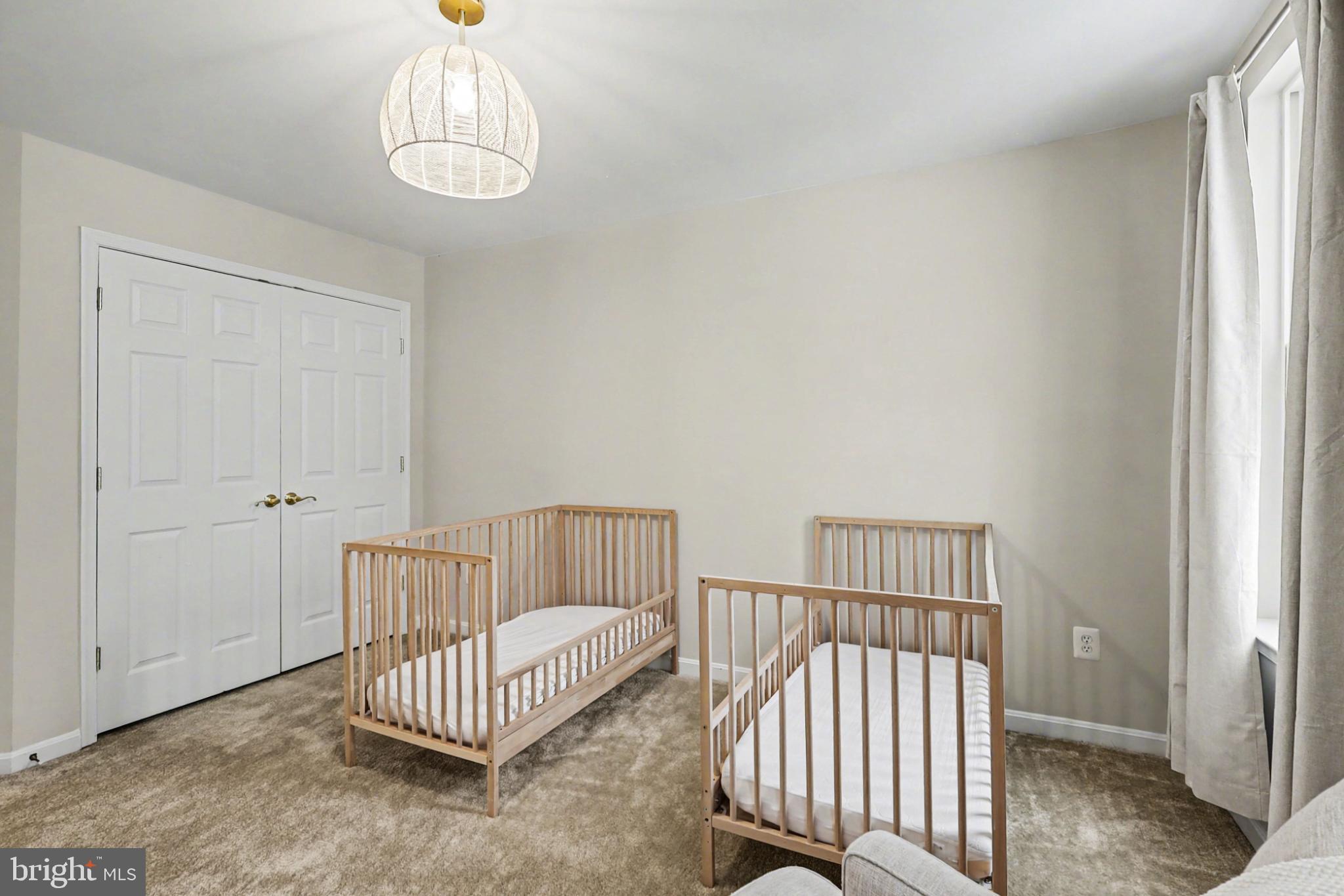 19201 Buna Street Triangle, VA 22172 - Photo 50 of 69 Bright and airy nursery with twin cribs.